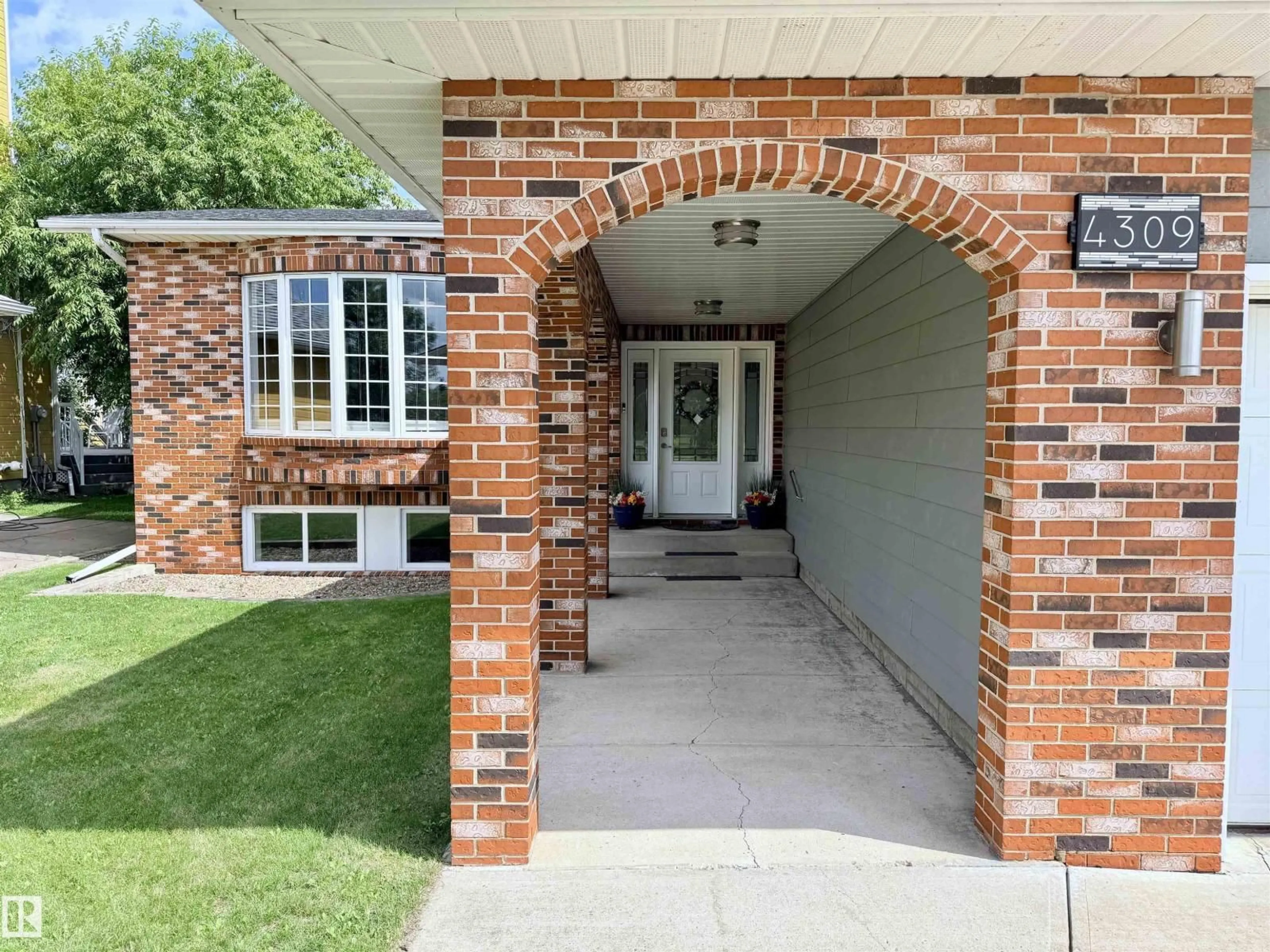 Home with brick exterior material, street for 4309 53 ST, St. Paul Town Alberta T0A3A4