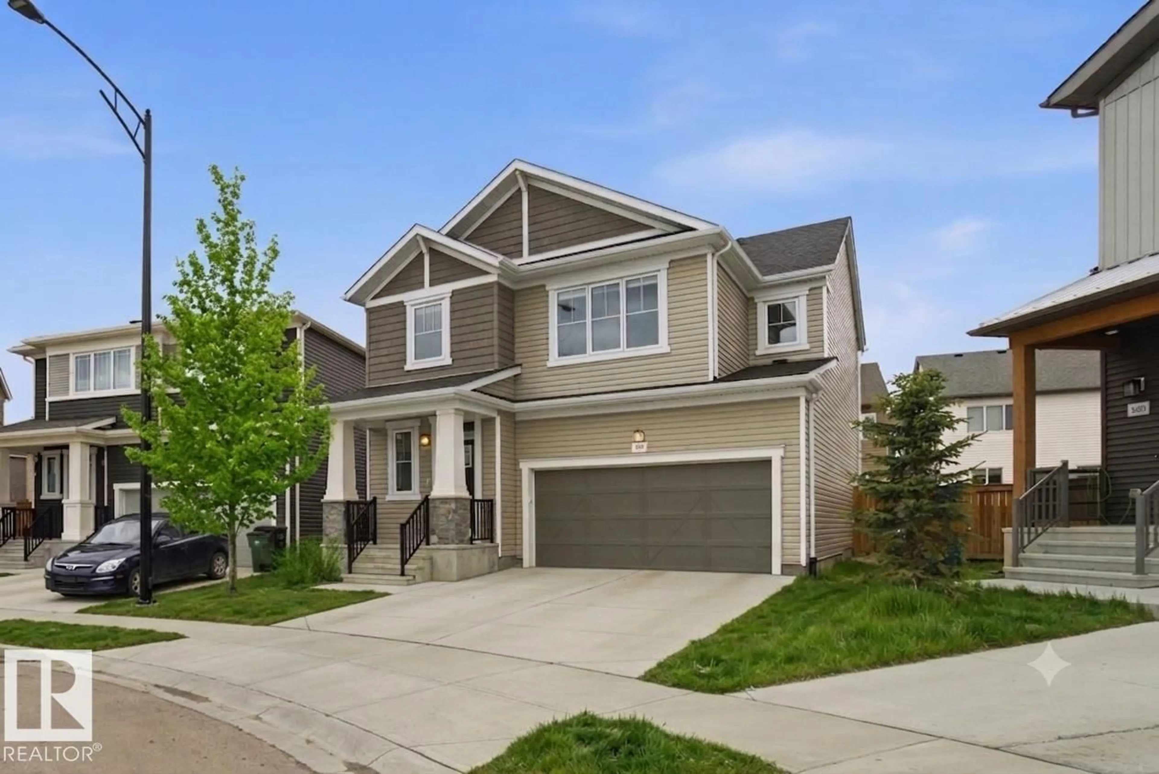 Home with vinyl exterior material, street for NW - 1607 202 ST, Edmonton Alberta T6M1K6