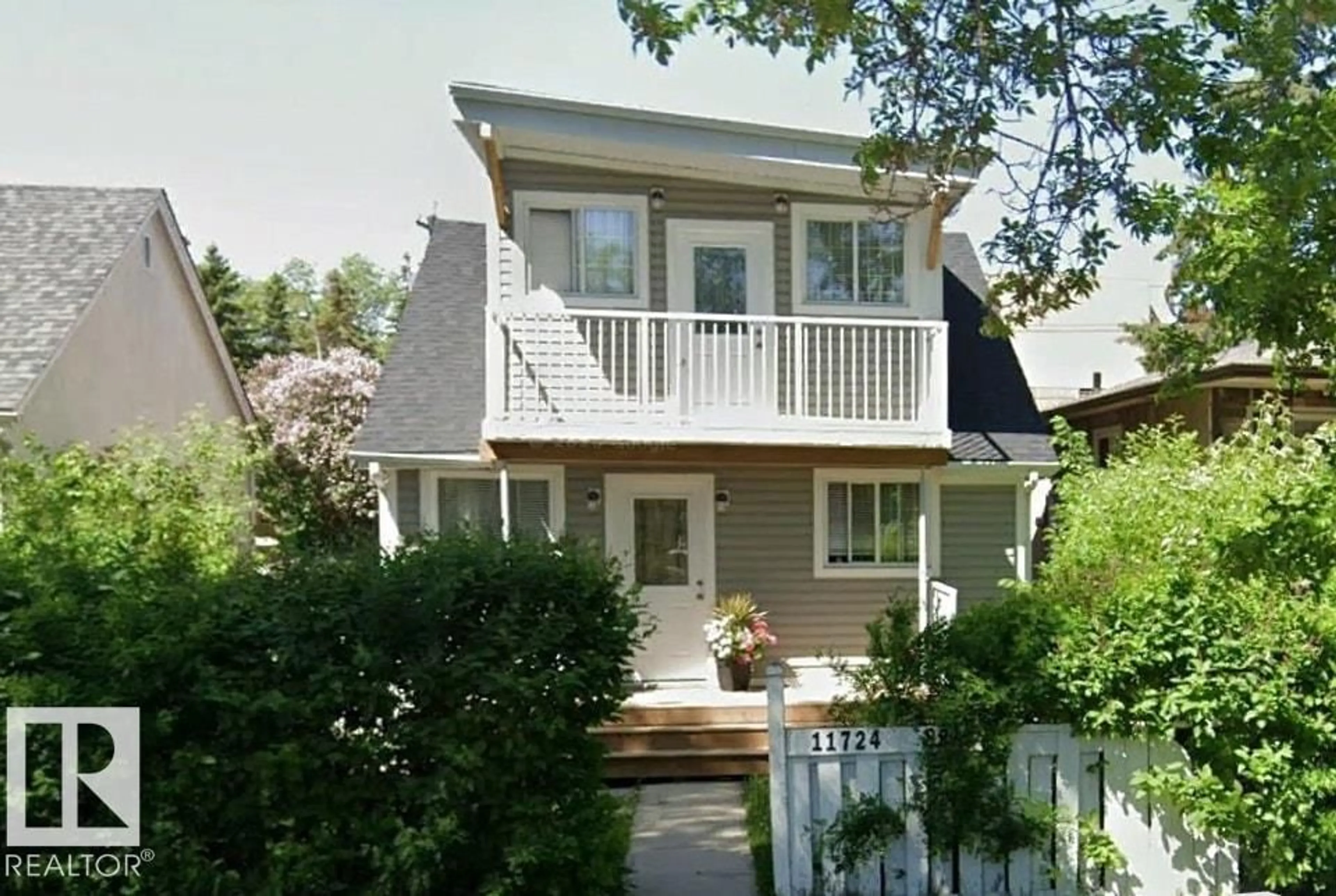 Home with vinyl exterior material, street for 11724 88 ST, Edmonton Alberta T5B3R7