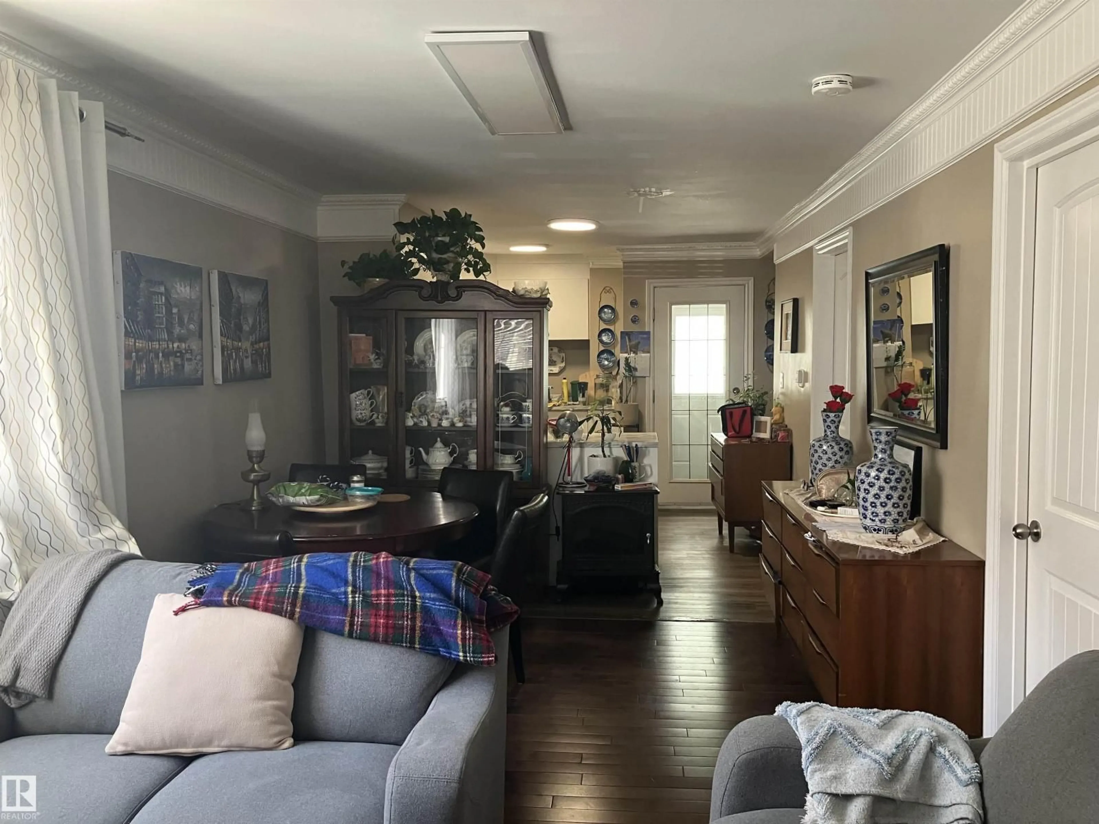 Living room with furniture, unknown for 11724 88 ST, Edmonton Alberta T5B3R7