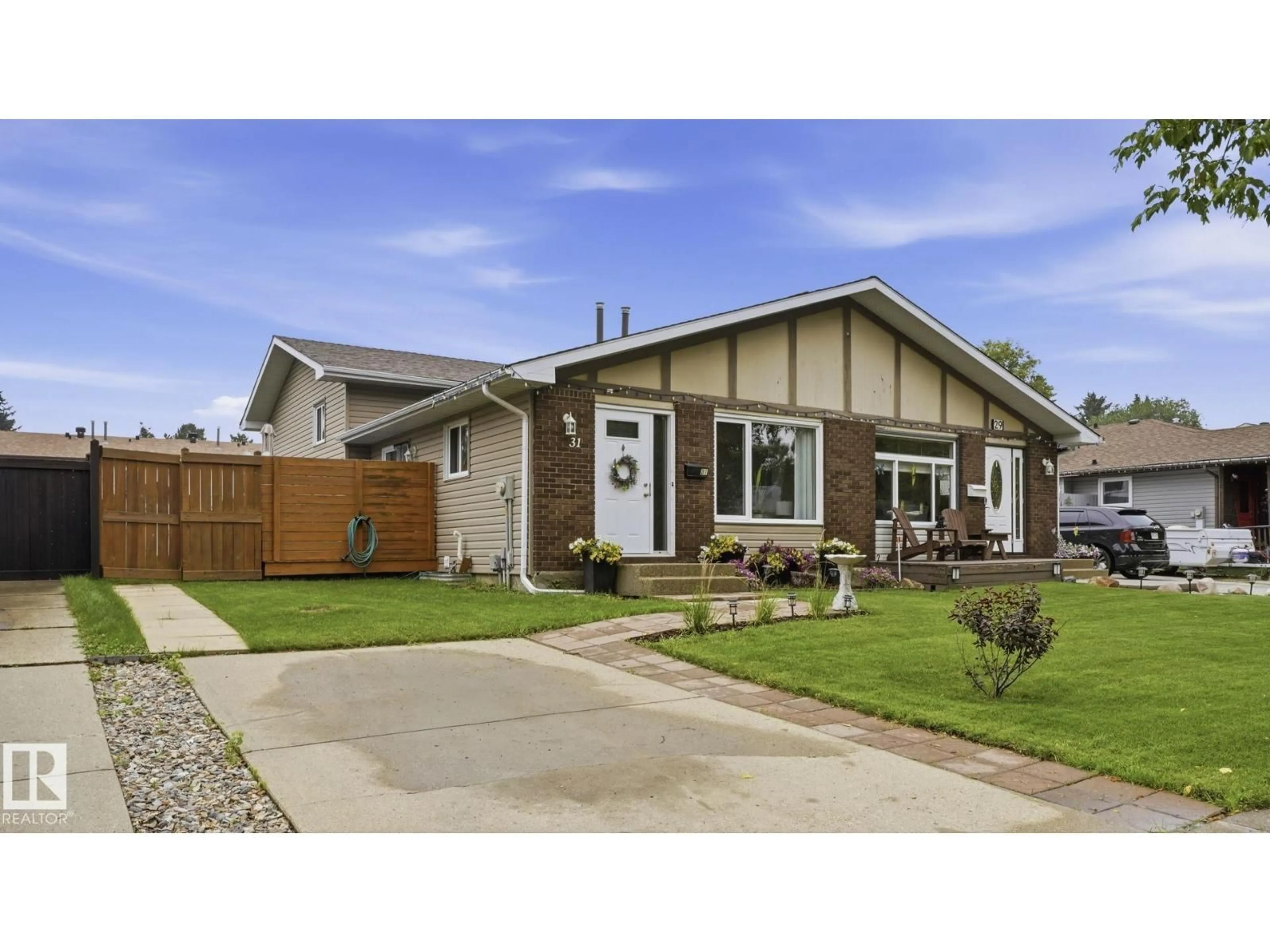 Home with vinyl exterior material, street for 31 WALDEN CR, St. Albert Alberta T8N3V6