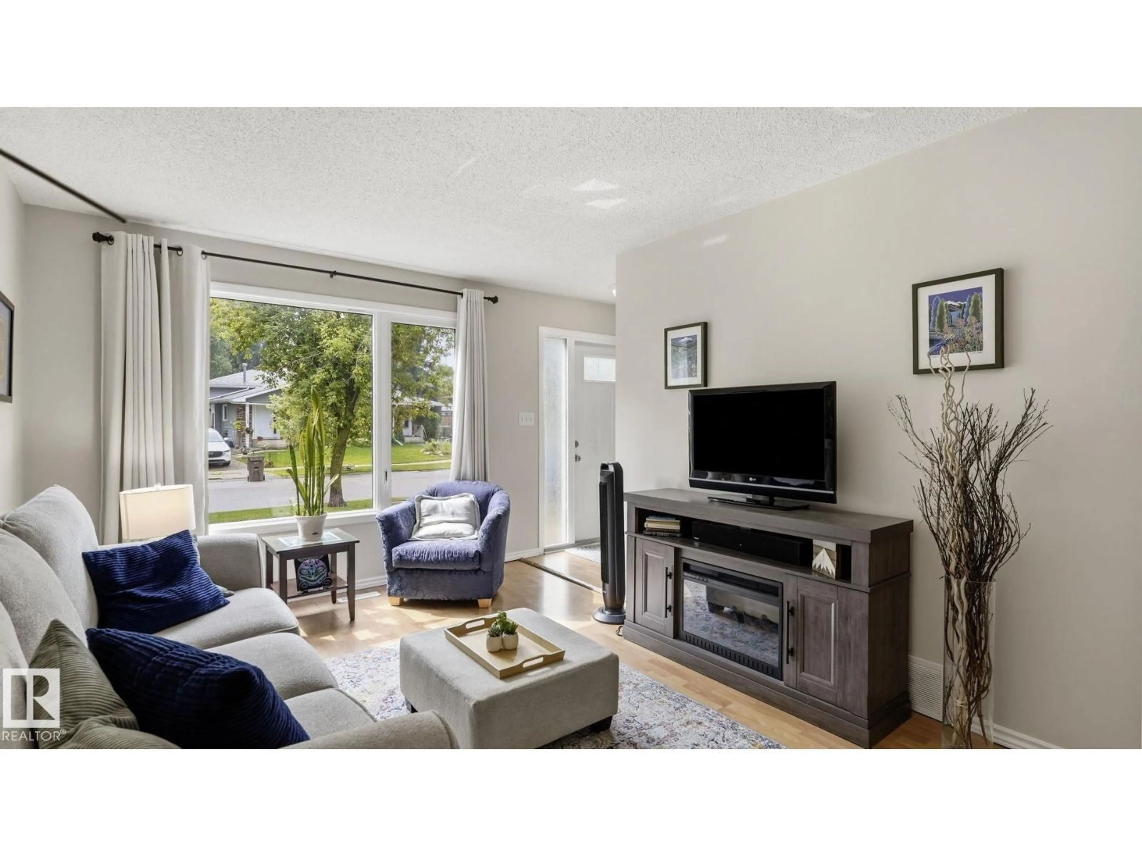 Living room with furniture, wood/laminate floor for 31 WALDEN CR, St. Albert Alberta T8N3V6