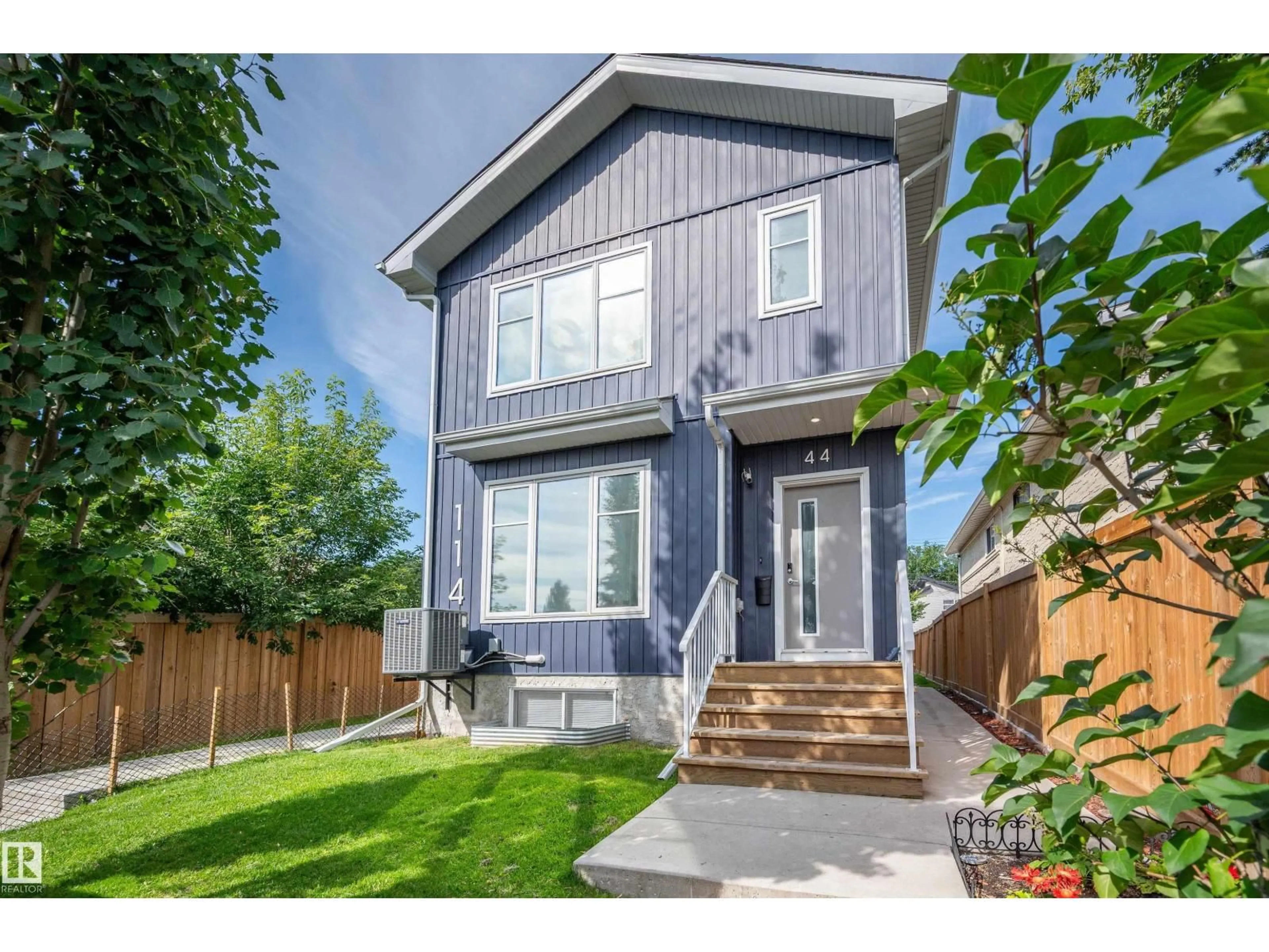 Home with vinyl exterior material, street for NW - 11444 82 ST, Edmonton Alberta T5B2V4