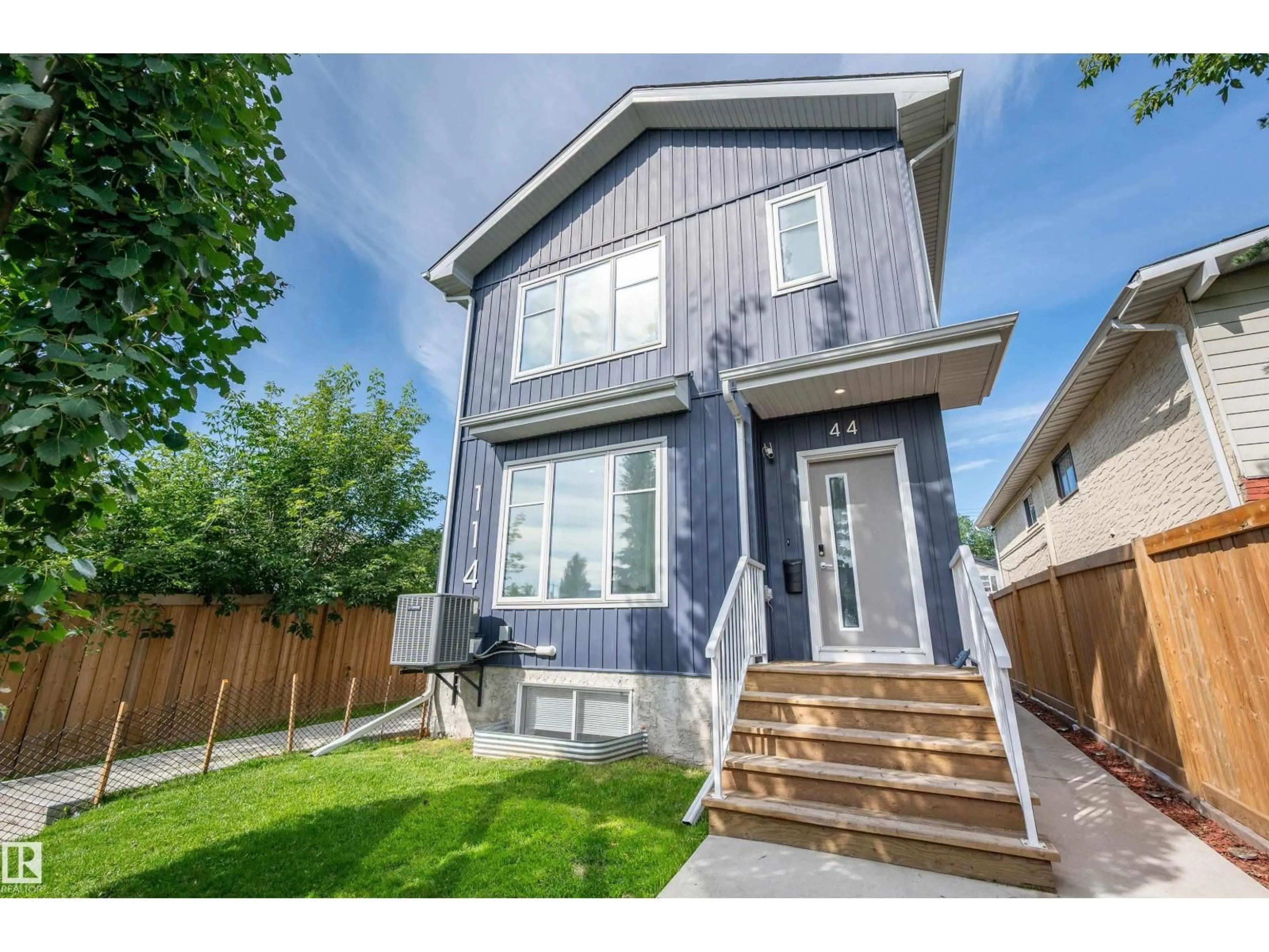 Home with vinyl exterior material, street for NW - 11444 82 ST, Edmonton Alberta T5B2V4