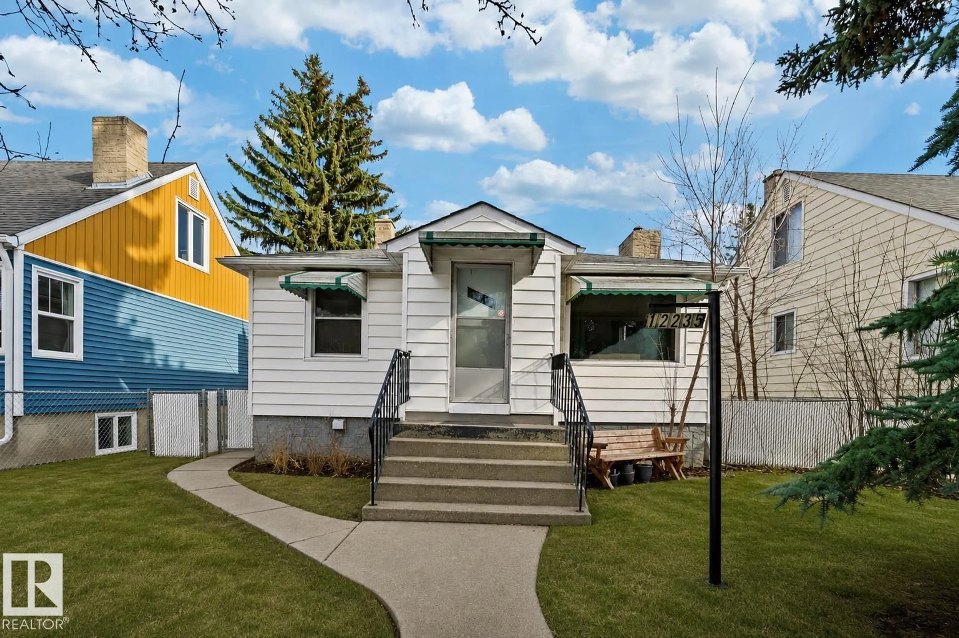 Home with vinyl exterior material, street for 12235 104 ST, Edmonton Alberta T5G2L7