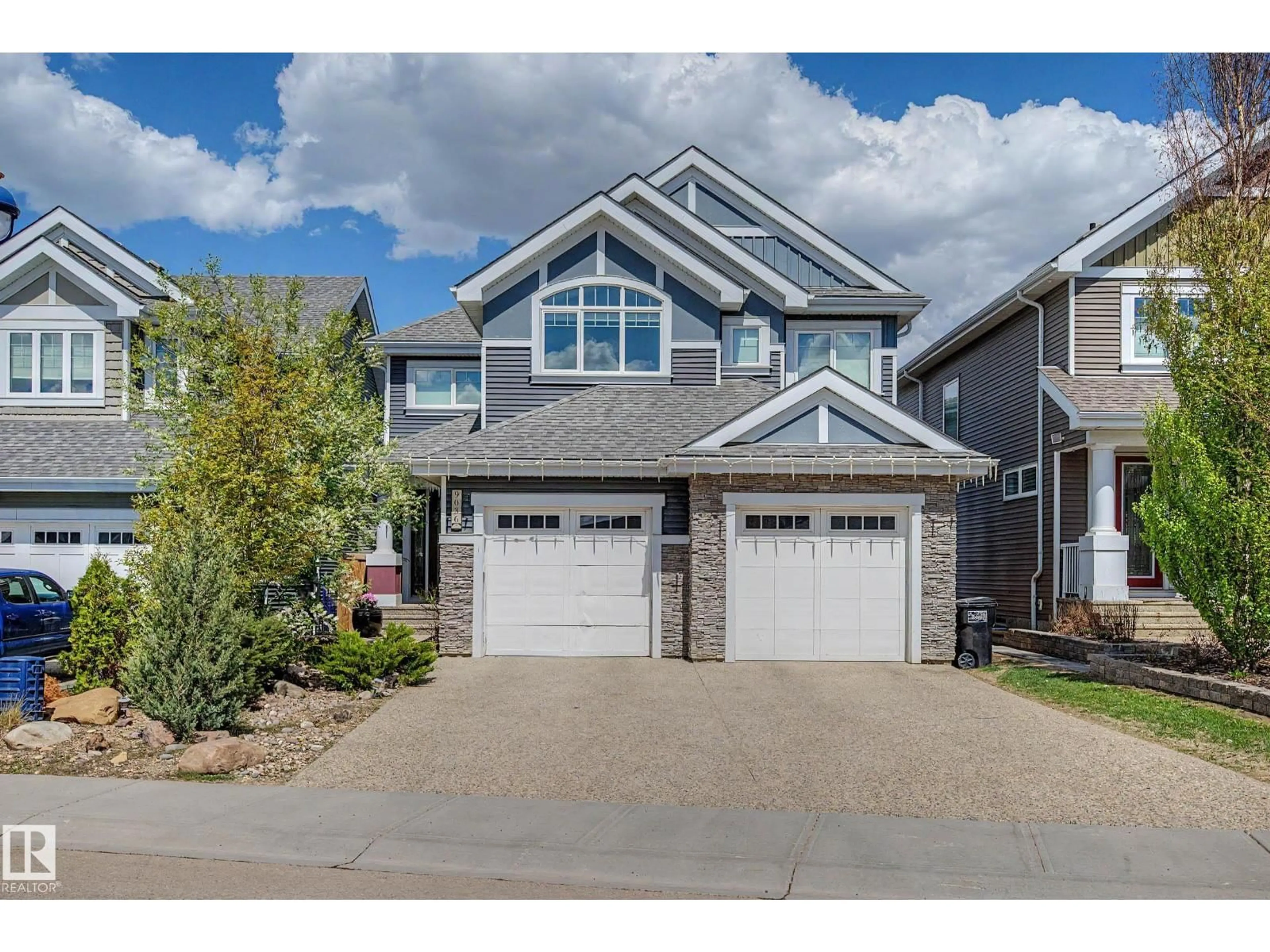 Home with vinyl exterior material, street for 9036 24 AV, Edmonton Alberta T6X2C4