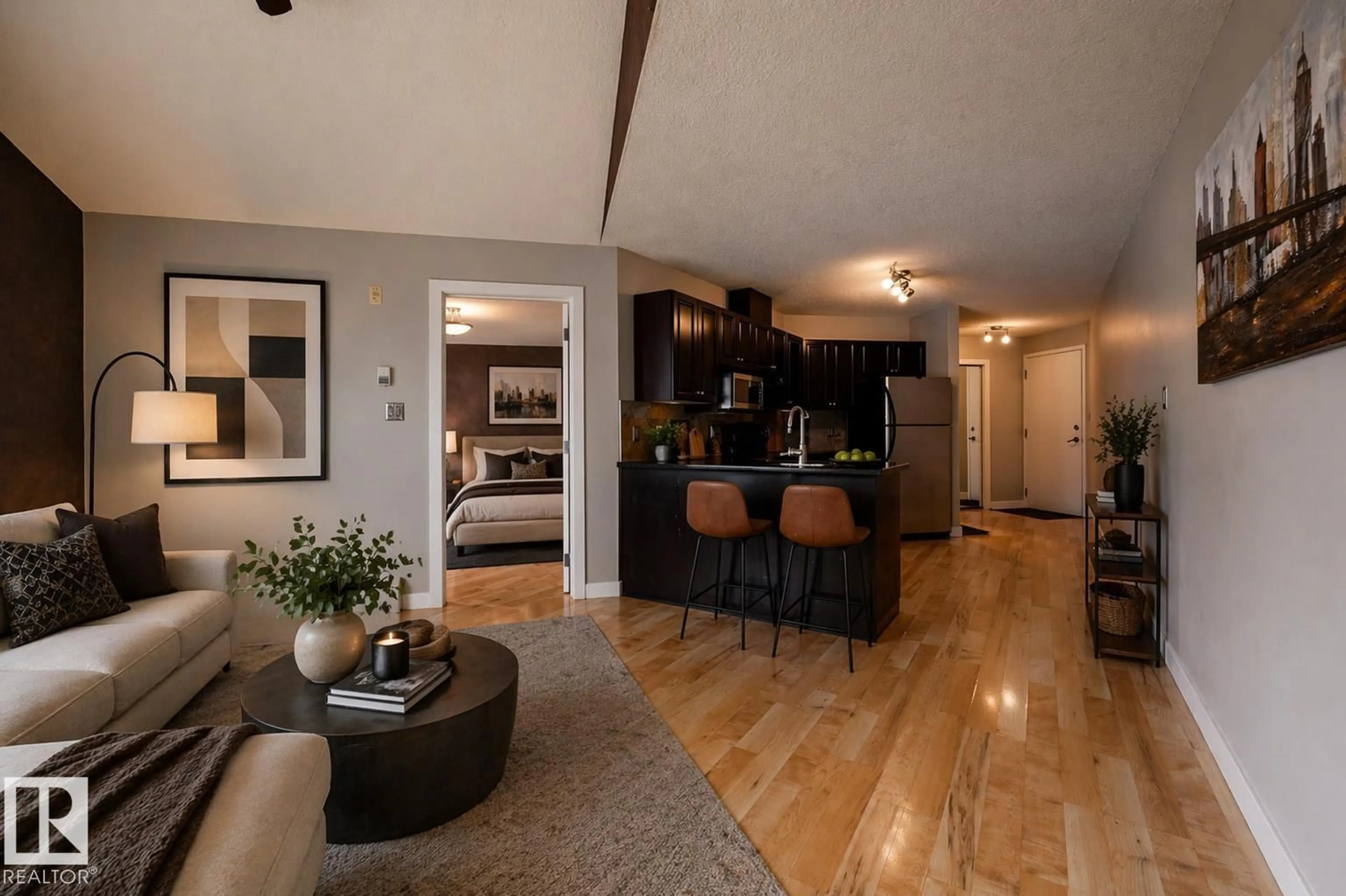 Open concept kitchen, wood/laminate floor for 304 - 9336 JASPER AV, Edmonton Alberta T5H3T5