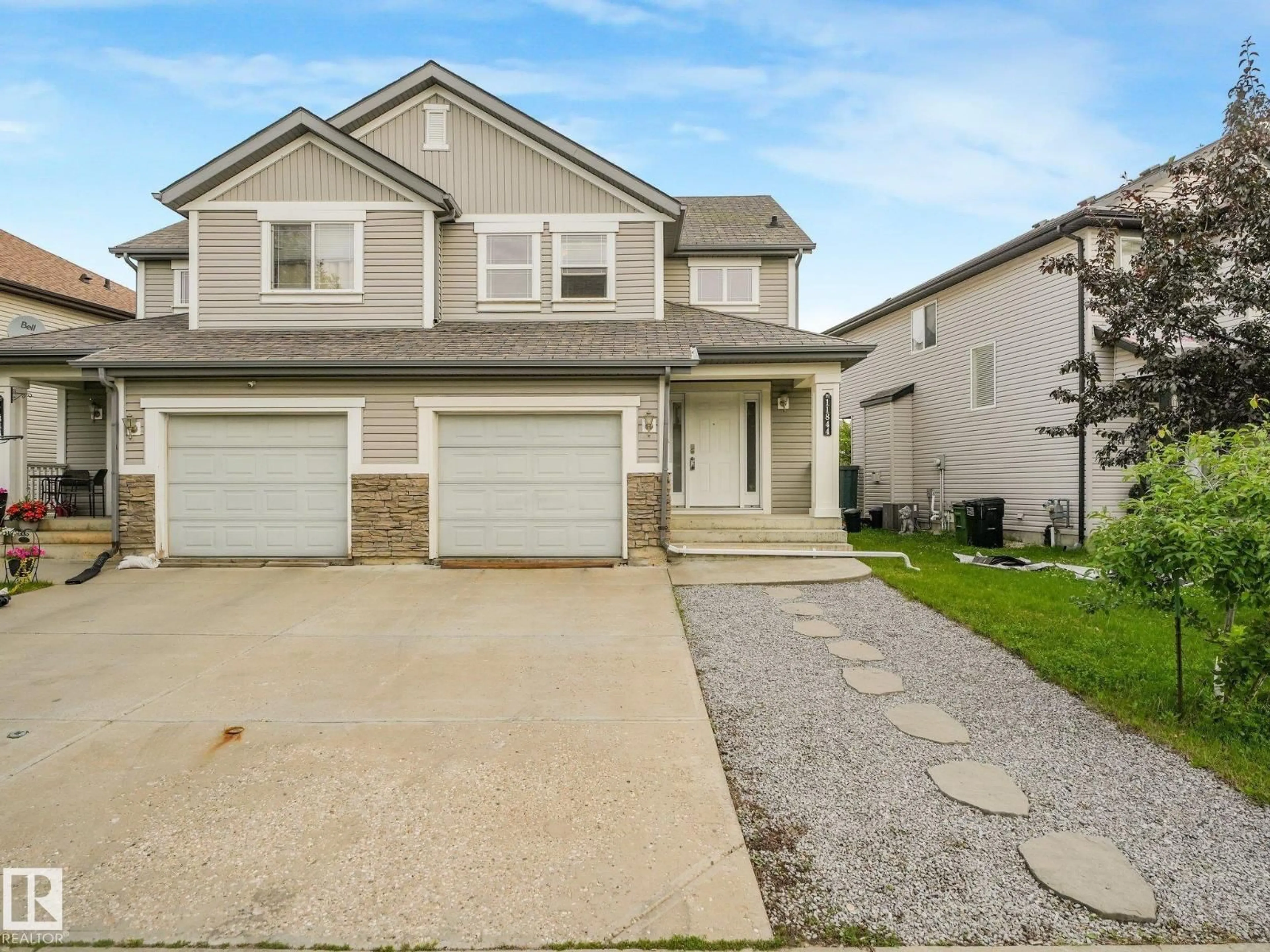 Home with vinyl exterior material, street for SW - 11844 21 AV, Edmonton Alberta T6W0C9