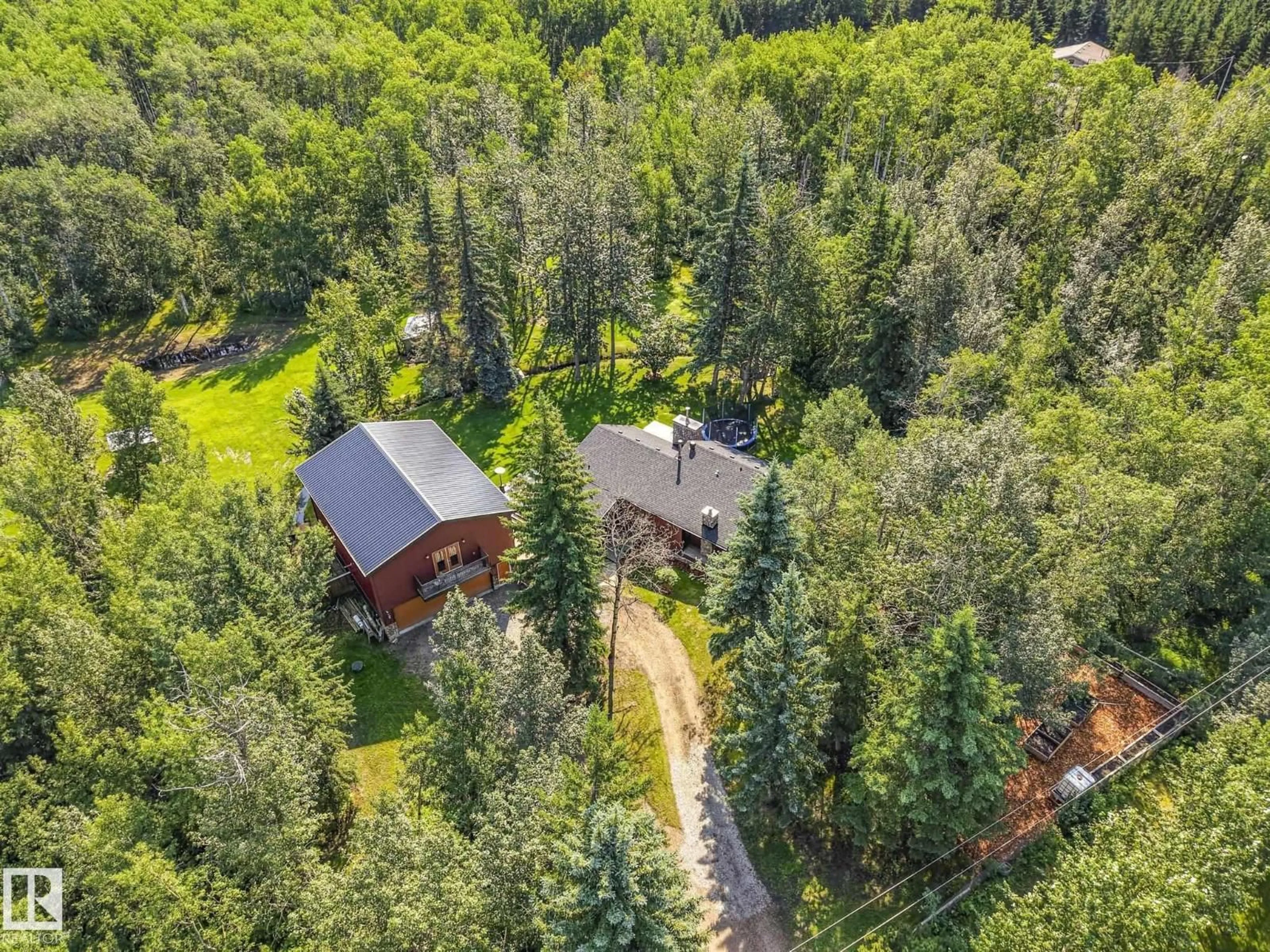 A pic from outside/outdoor area/front of a property/back of a property/a pic from drone, forest/trees view for 51112 - 382 RGE ROAD 222, Rural Strathcona County Alberta T8C1G9
