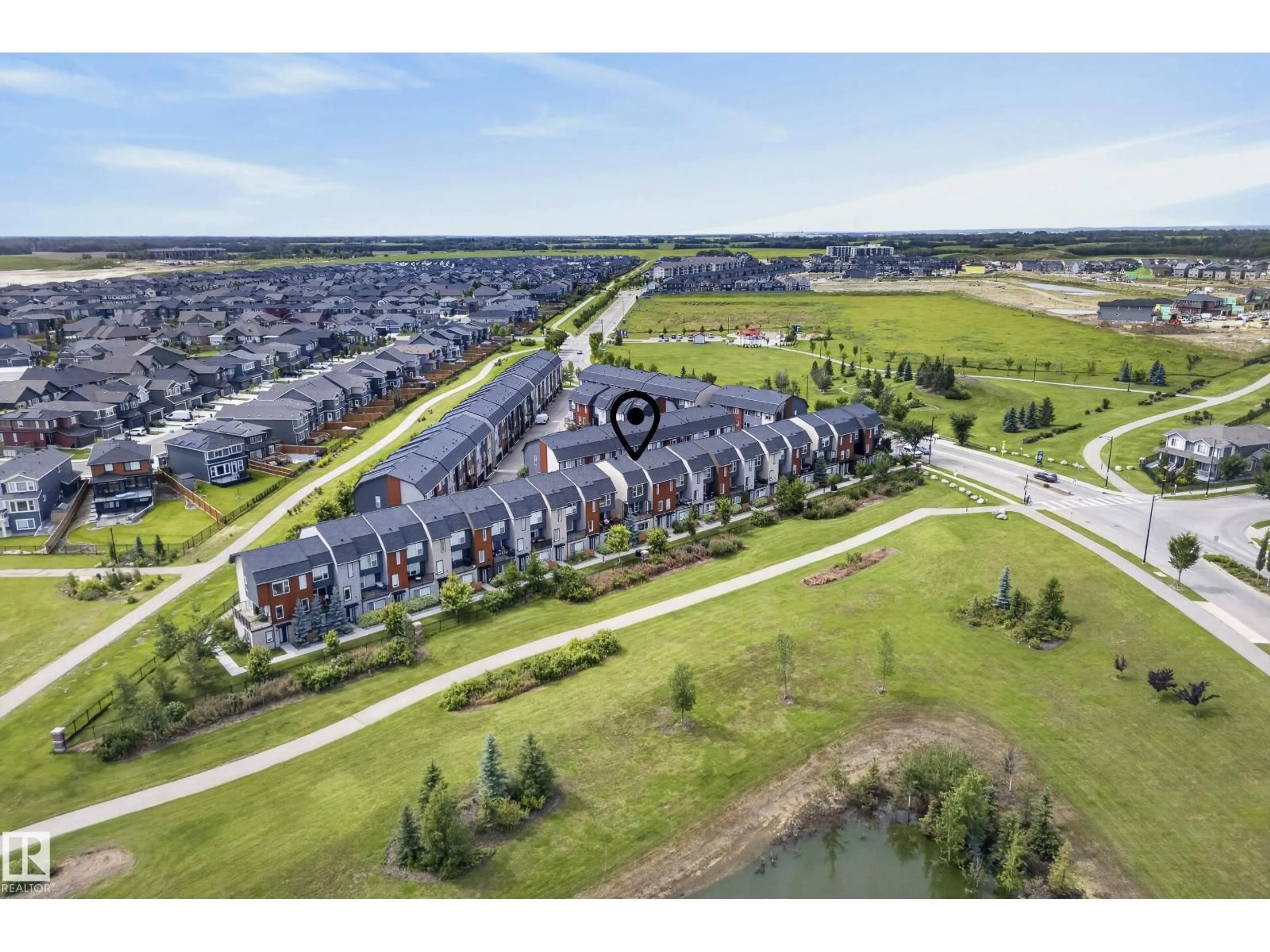 A pic from outside/outdoor area/front of a property/back of a property/a pic from drone, water/lake/river/ocean view for #10 - 1075 ROSENTHAL BV, Edmonton Alberta T5T7G5