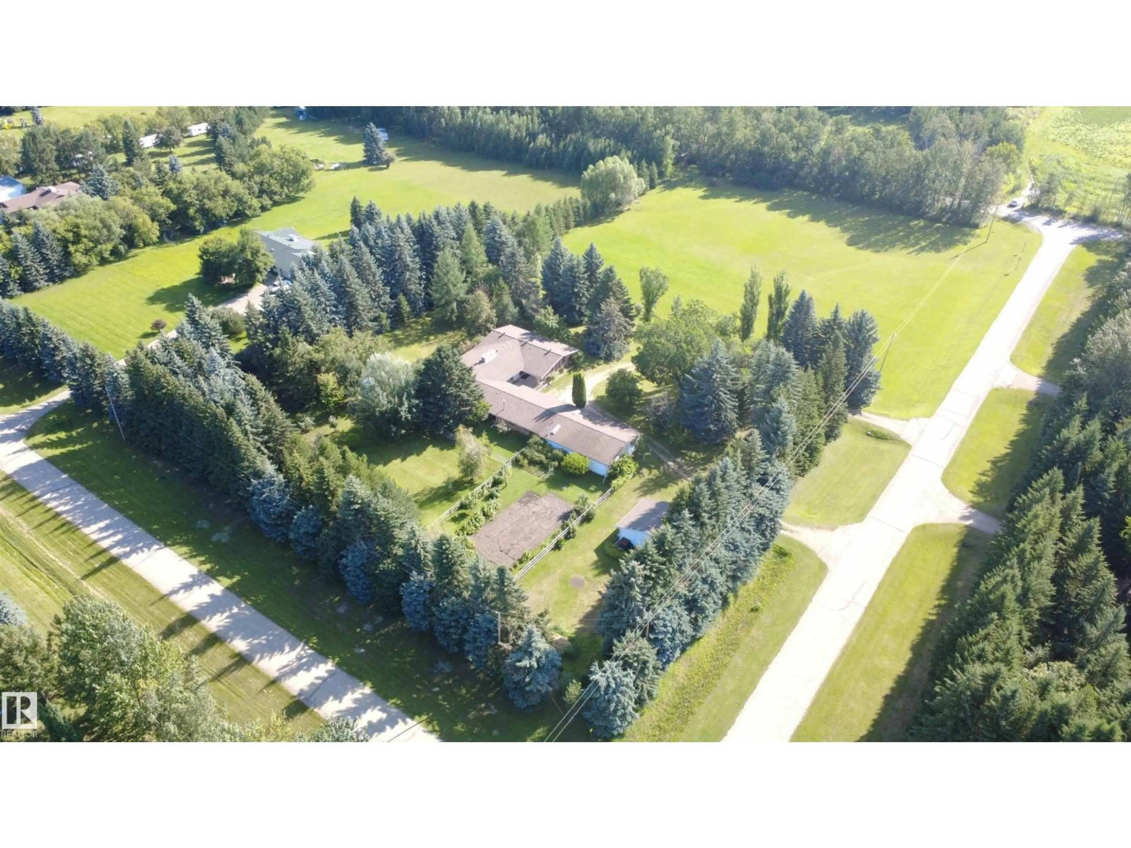 A pic from outside/outdoor area/front of a property/back of a property/a pic from drone, unknown for 24 25507 TWP ROAD 512 A, Rural Parkland County Alberta T7X1A8