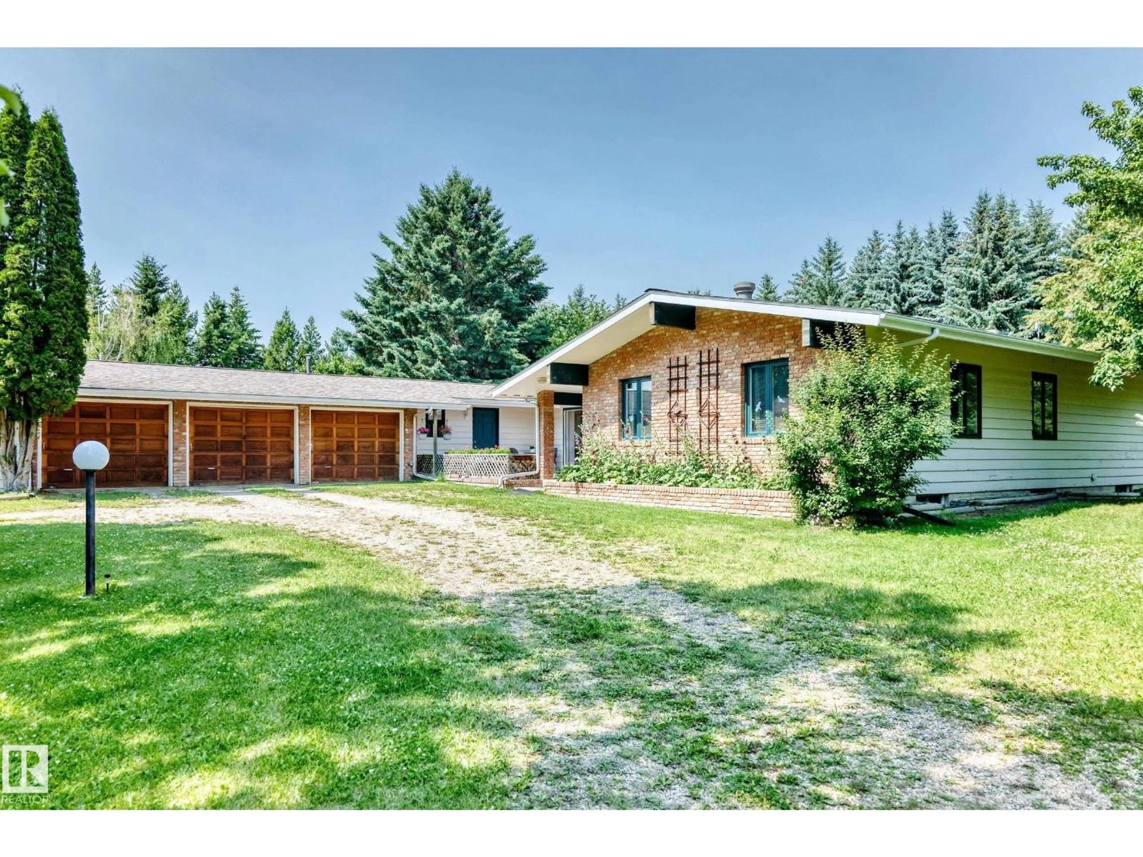 A pic from outside/outdoor area/front of a property/back of a property/a pic from drone, street for 24 25507 TWP ROAD 512 A, Rural Parkland County Alberta T7X1A8