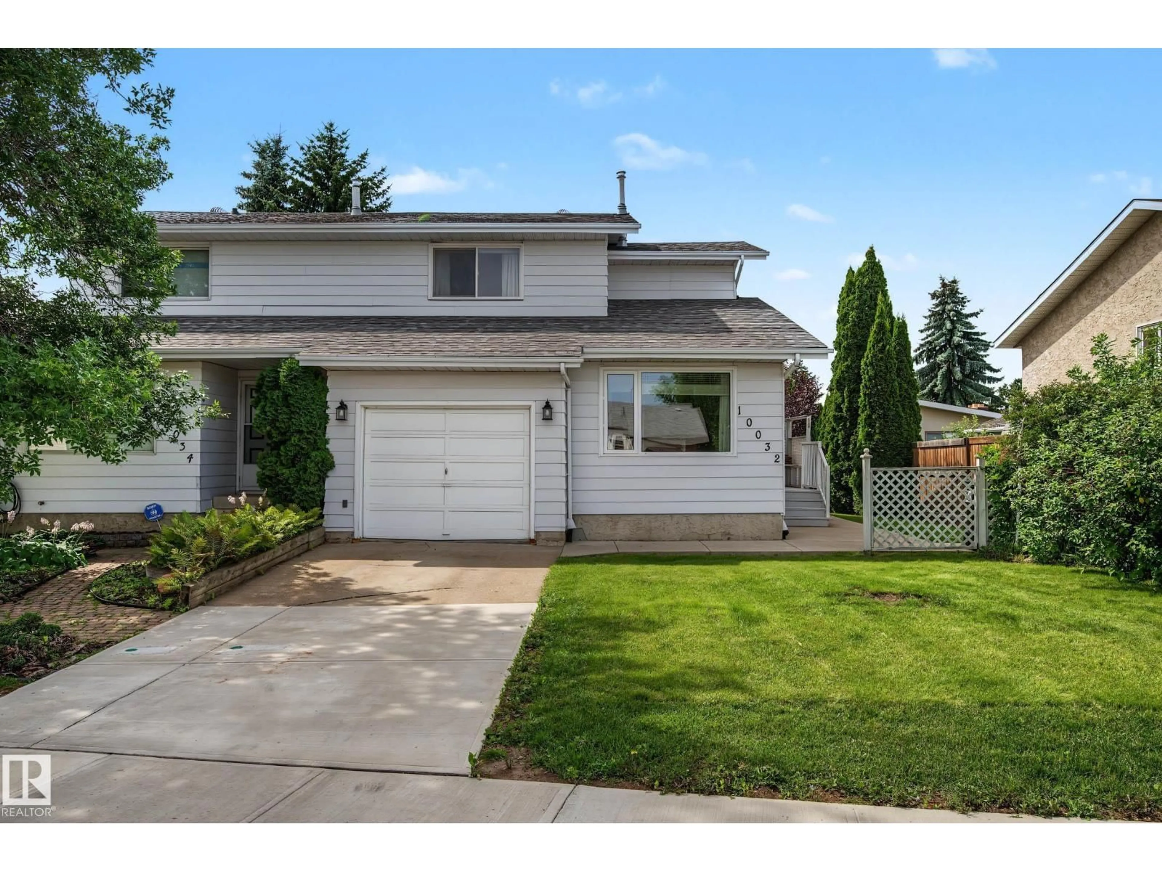 Home with vinyl exterior material, street for 10032 173 AV, Edmonton Alberta T5X3X9
