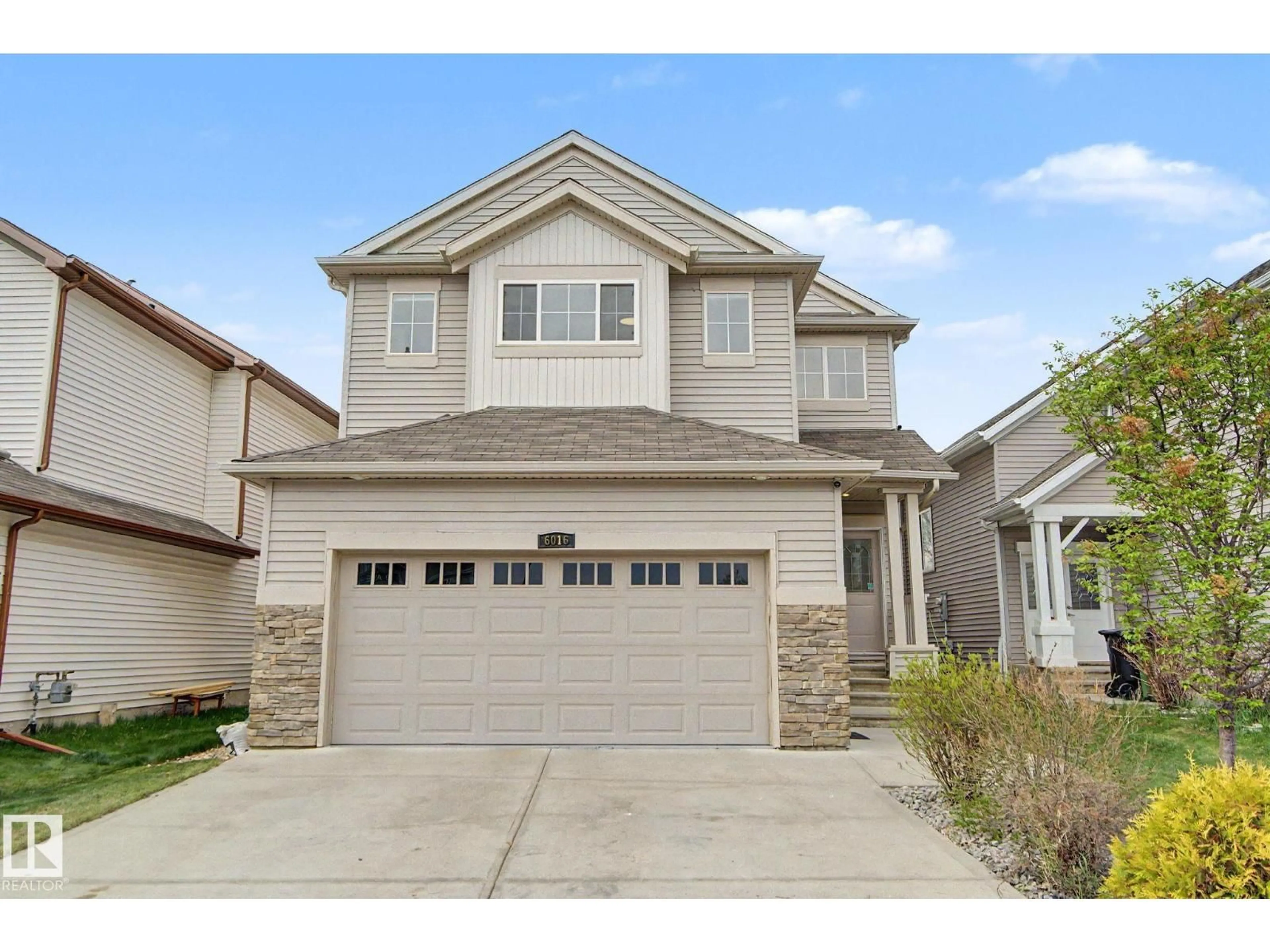 Home with vinyl exterior material, street for SW - 6016 10 AV, Edmonton Alberta T6X0M3