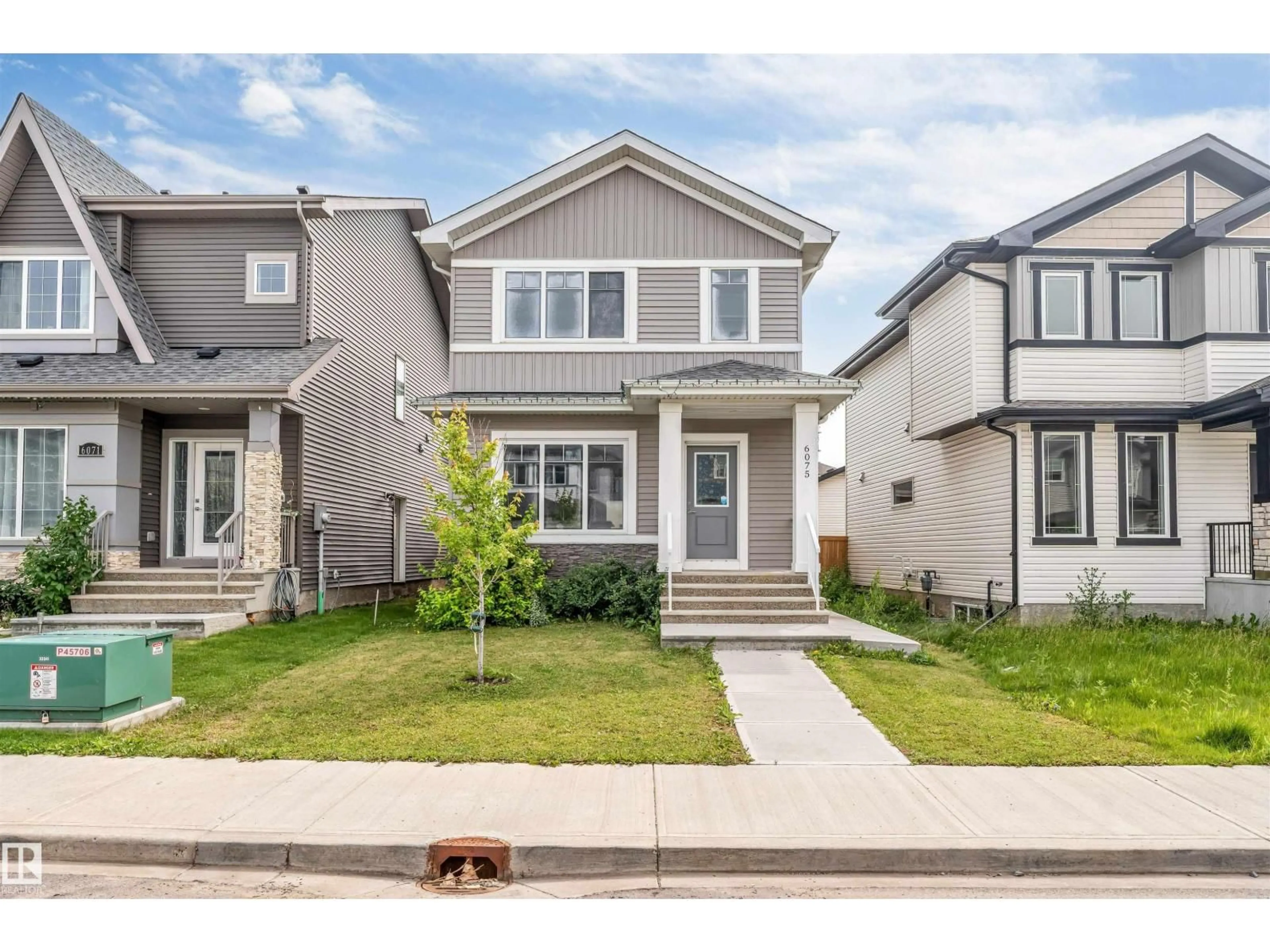 Home with vinyl exterior material, street for 6075 180 AV, Edmonton Alberta T5Y3X1