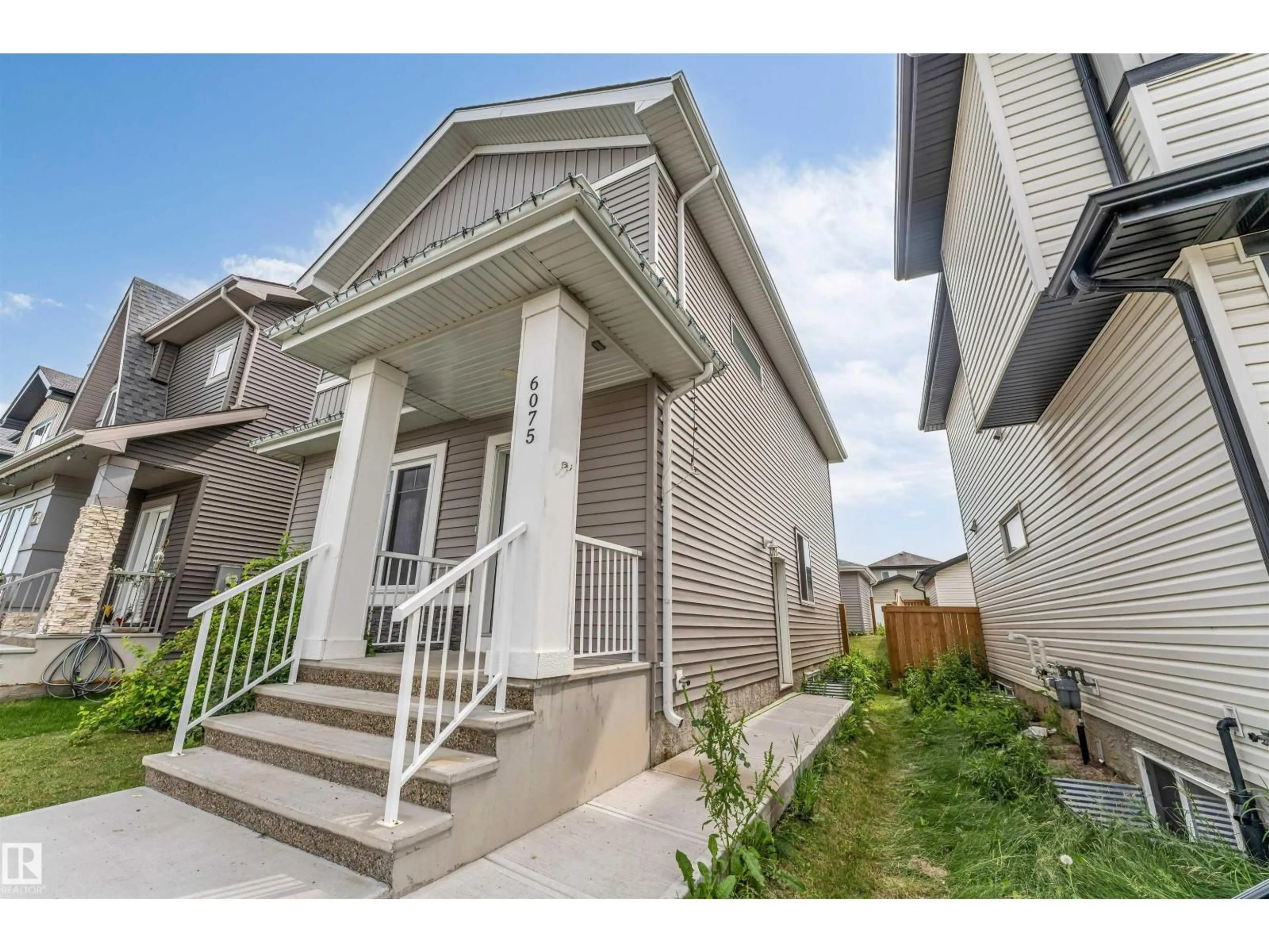 Home with brick exterior material, street for 6075 180 AV, Edmonton Alberta T5Y3X1