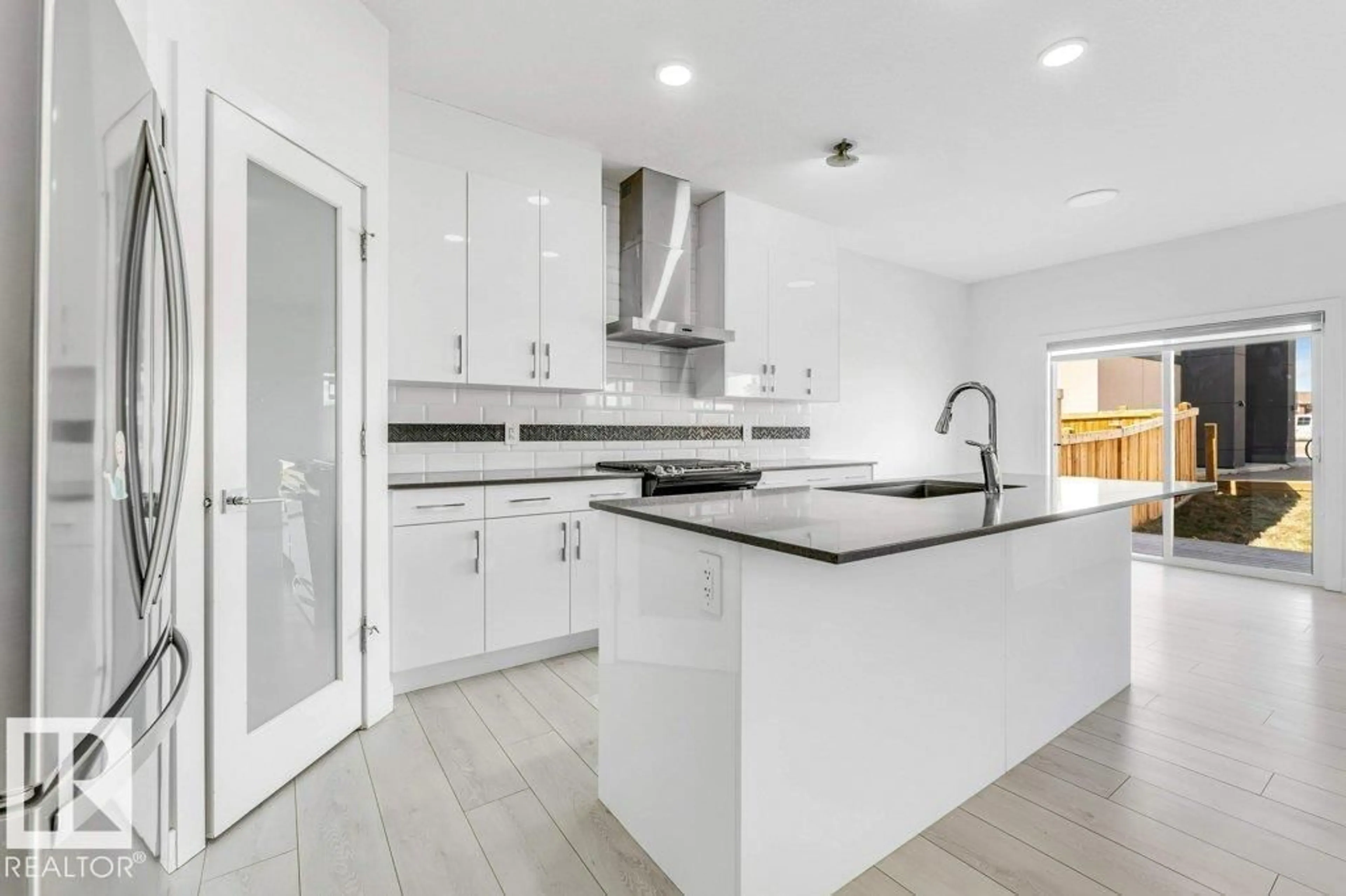 Open concept kitchen, ceramic/tile floor for 5140 23 AV, Edmonton Alberta T6X2X4