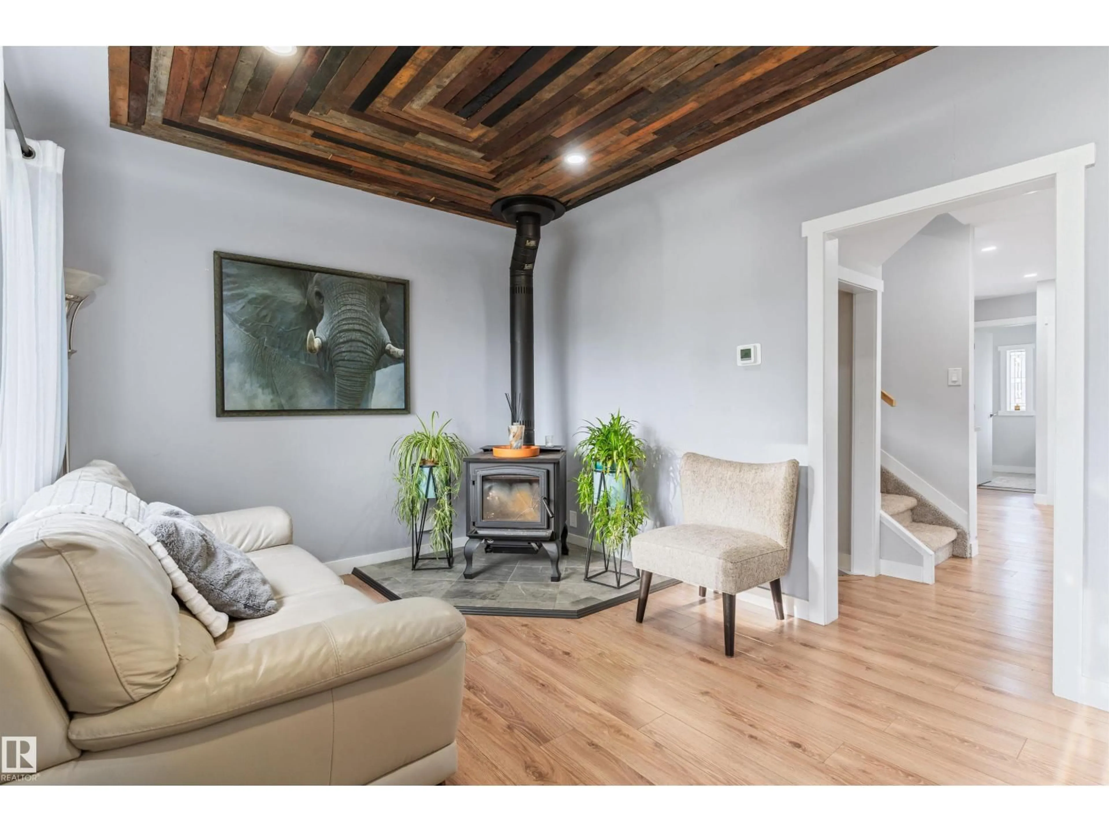 Living room with furniture, wood/laminate floor for 5019 49 ST, Calmar Alberta T0C0V0