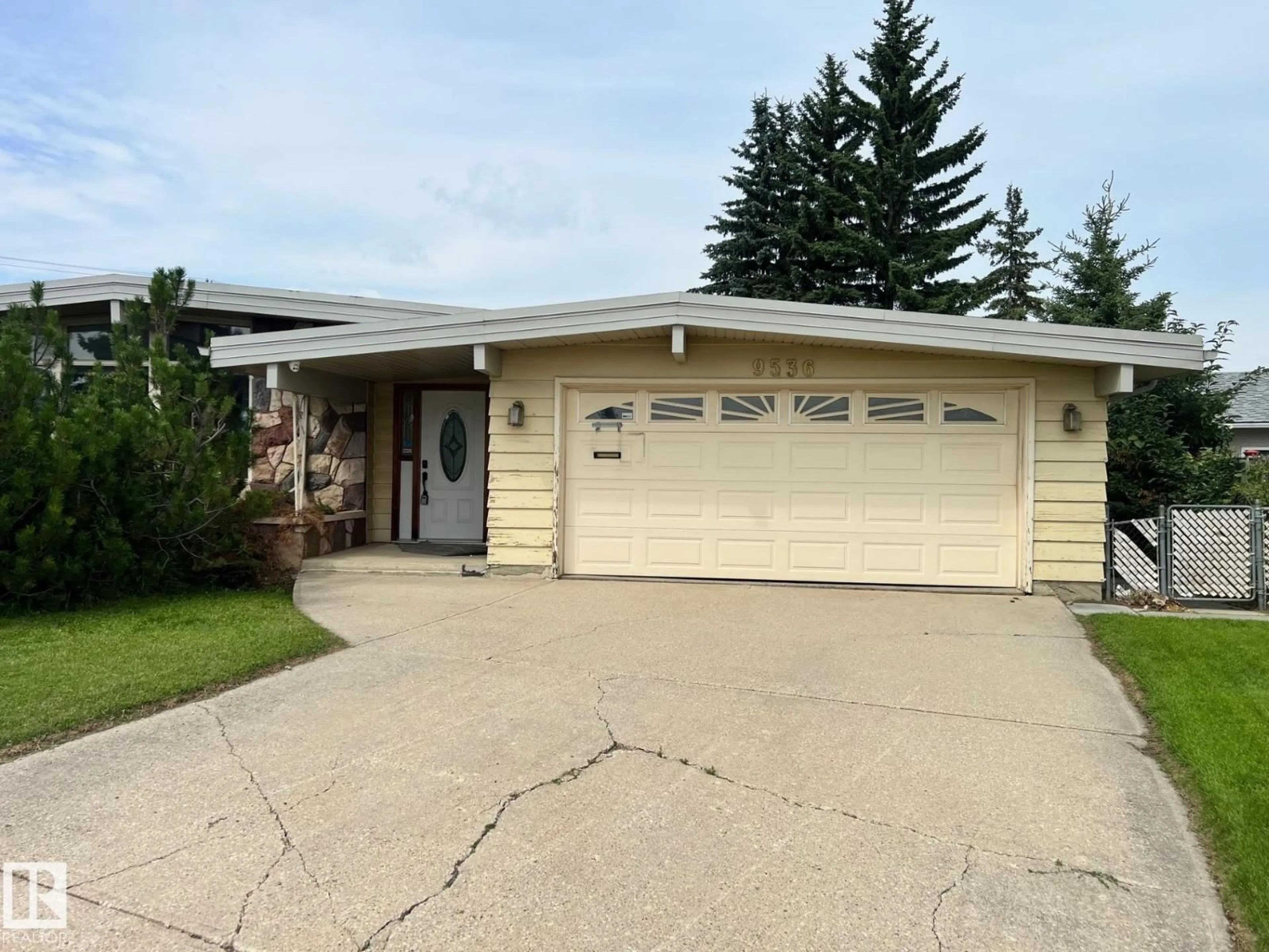 Home with vinyl exterior material, street for 9536 151 AV, Edmonton Alberta T5E2R3