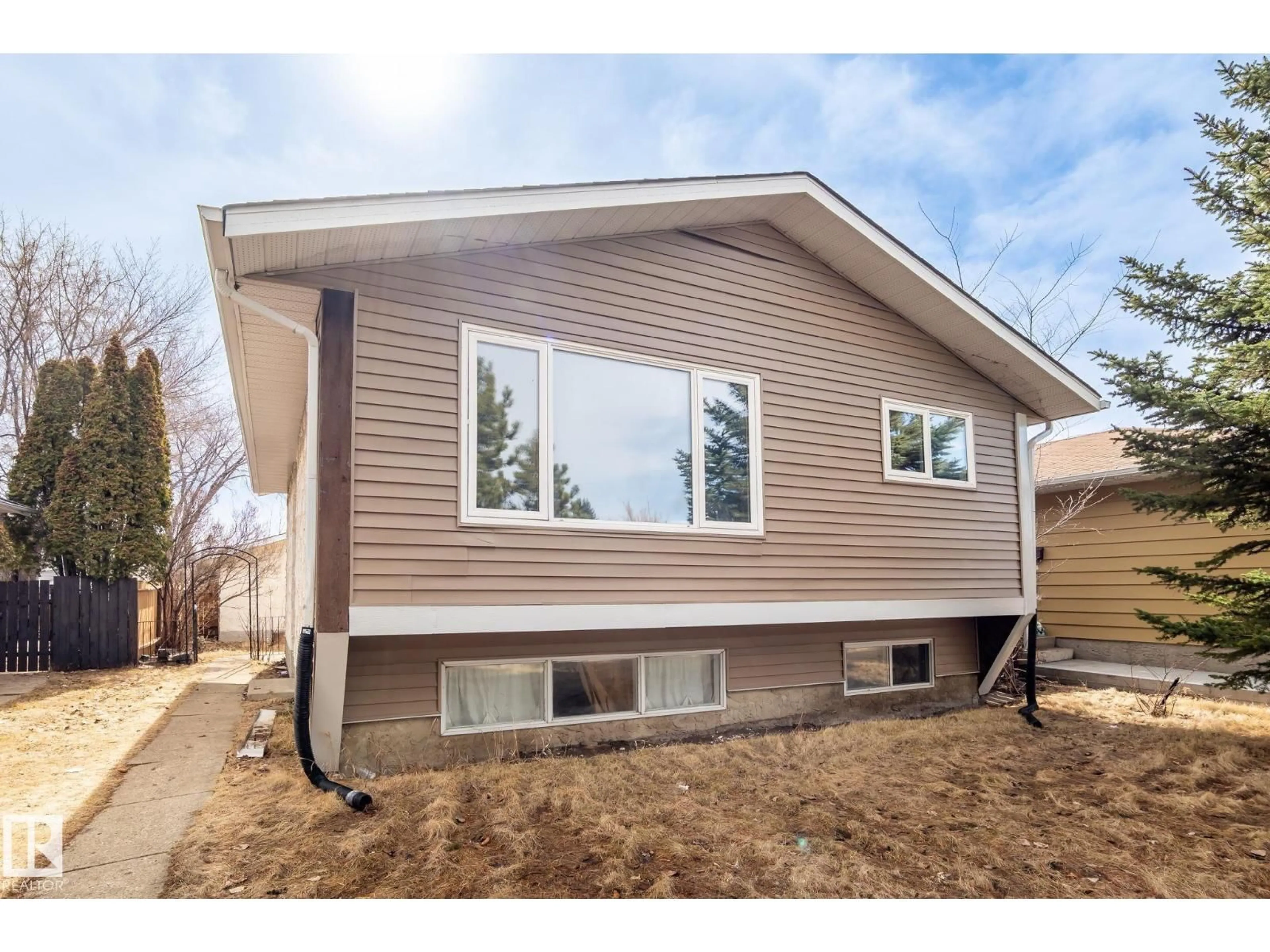 Home with vinyl exterior material, street for 1566 LAKEWOOD ROAD, Edmonton Alberta T6K2V9