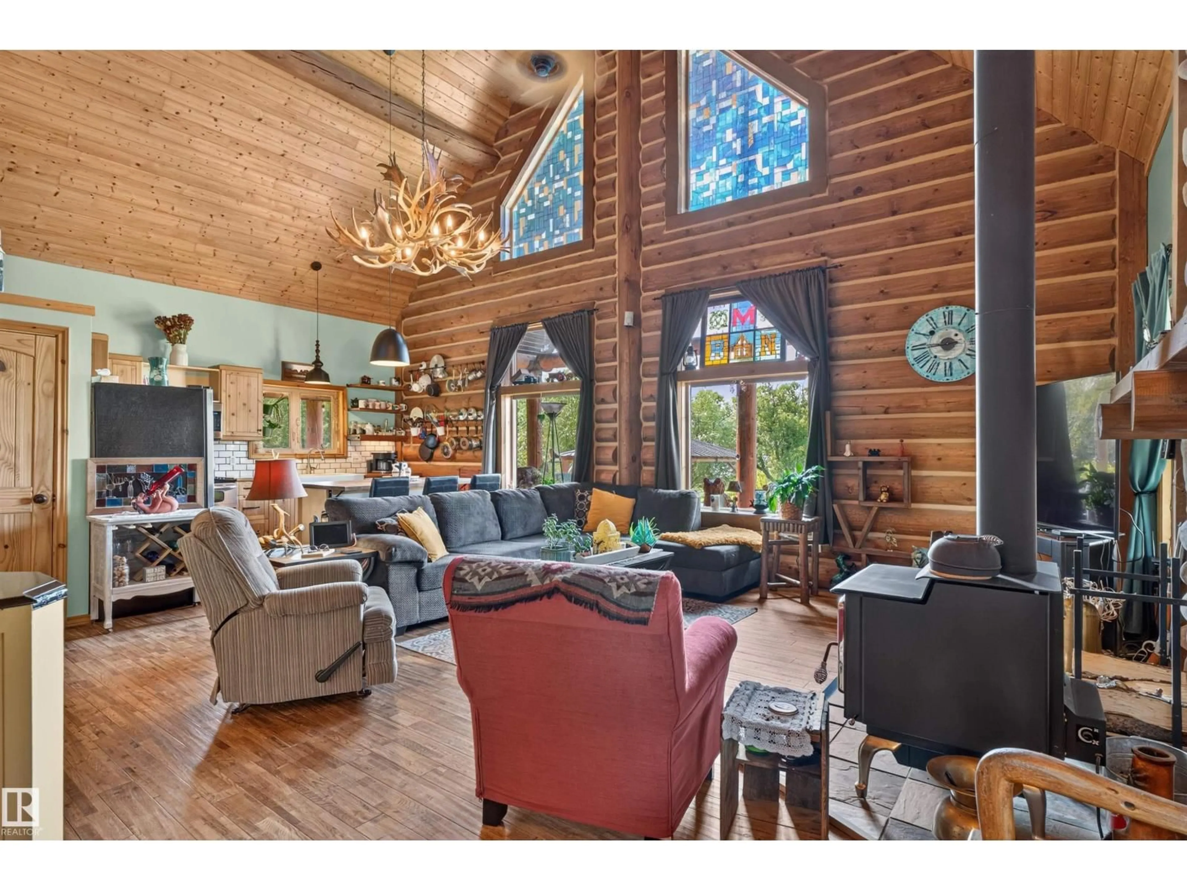 Living room with furniture, wood/laminate floor for 107 IDLEHOURS DRIVE, Rural Barrhead County Alberta T0G1A0