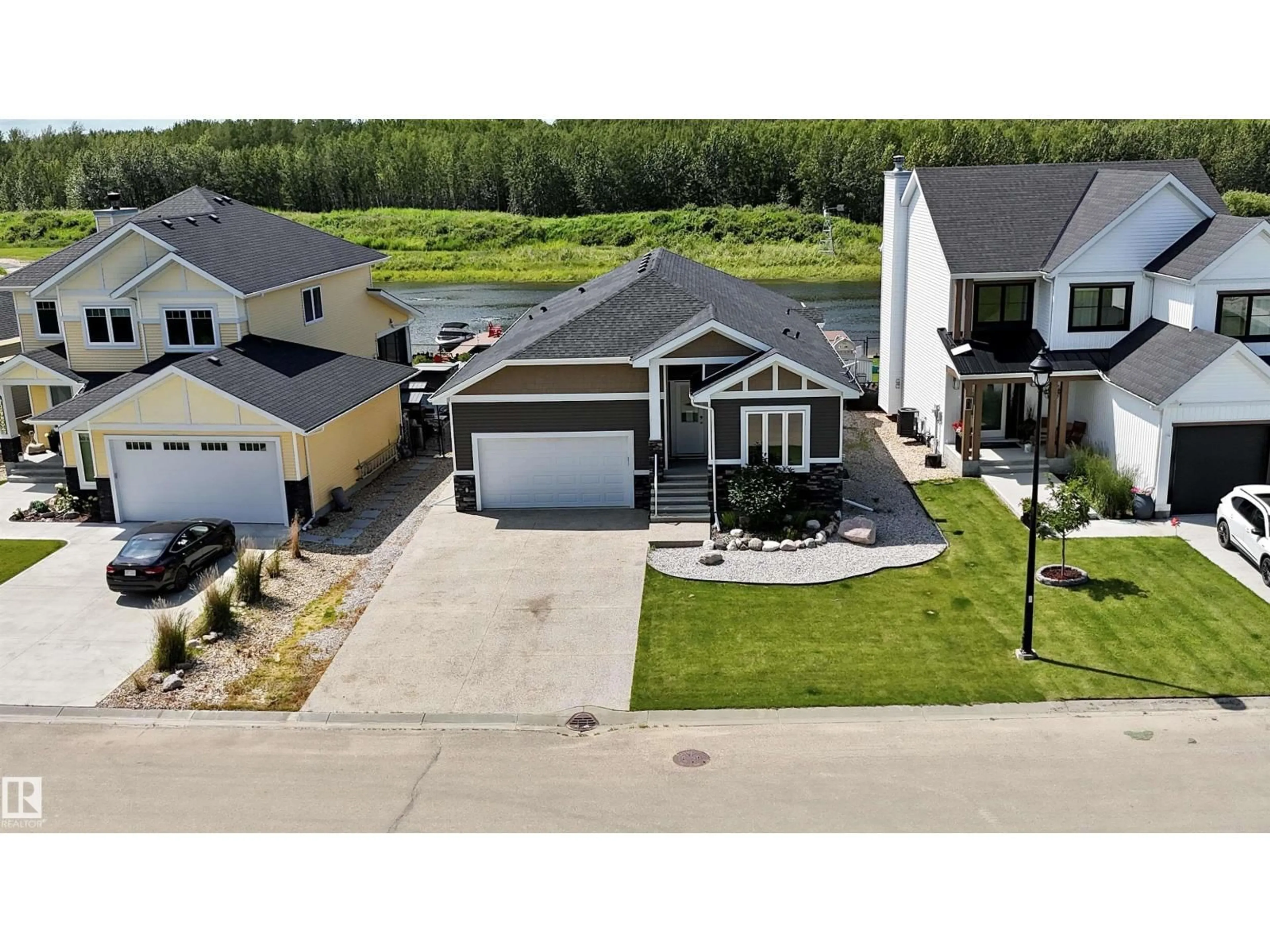 A pic from outside/outdoor area/front of a property/back of a property/a pic from drone, street for #20 - 3410 STE. ANNE TR, Rural Lac Ste. Anne County Alberta T0E0A1