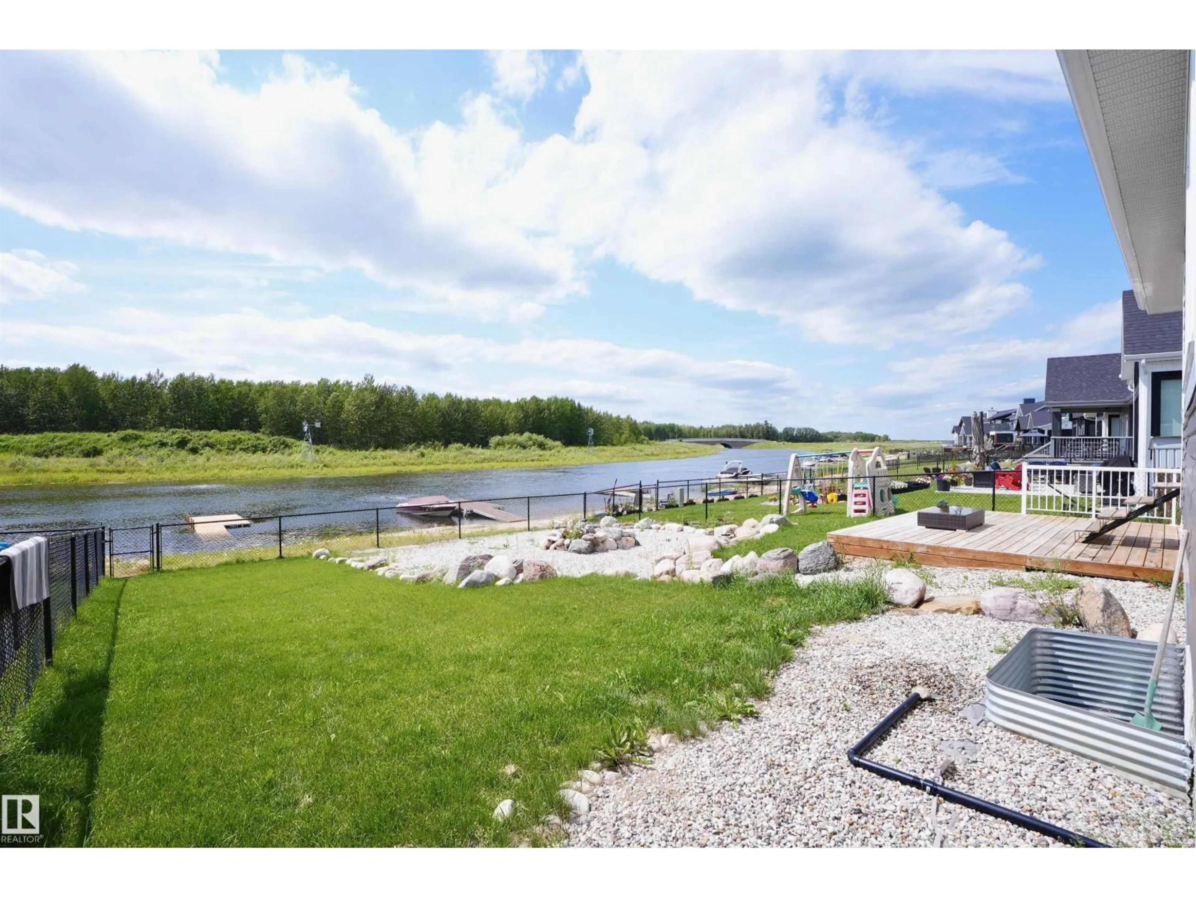 A pic from outside/outdoor area/front of a property/back of a property/a pic from drone, water/lake/river/ocean view for #20 - 3410 STE. ANNE TR, Rural Lac Ste. Anne County Alberta T0E0A1