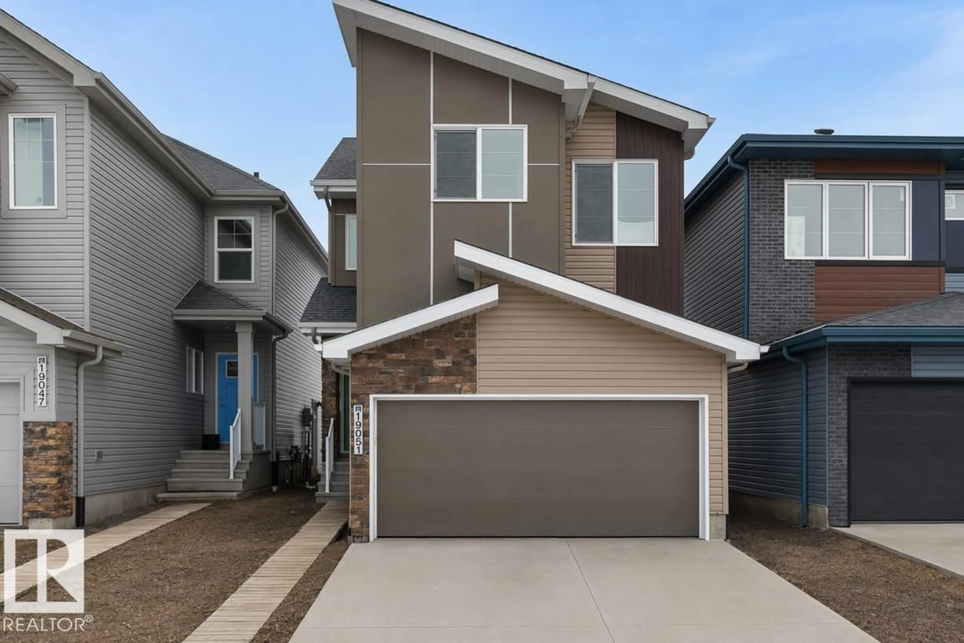 Home with vinyl exterior material, street for 19051 20 AV, Edmonton Alberta T6M3E8