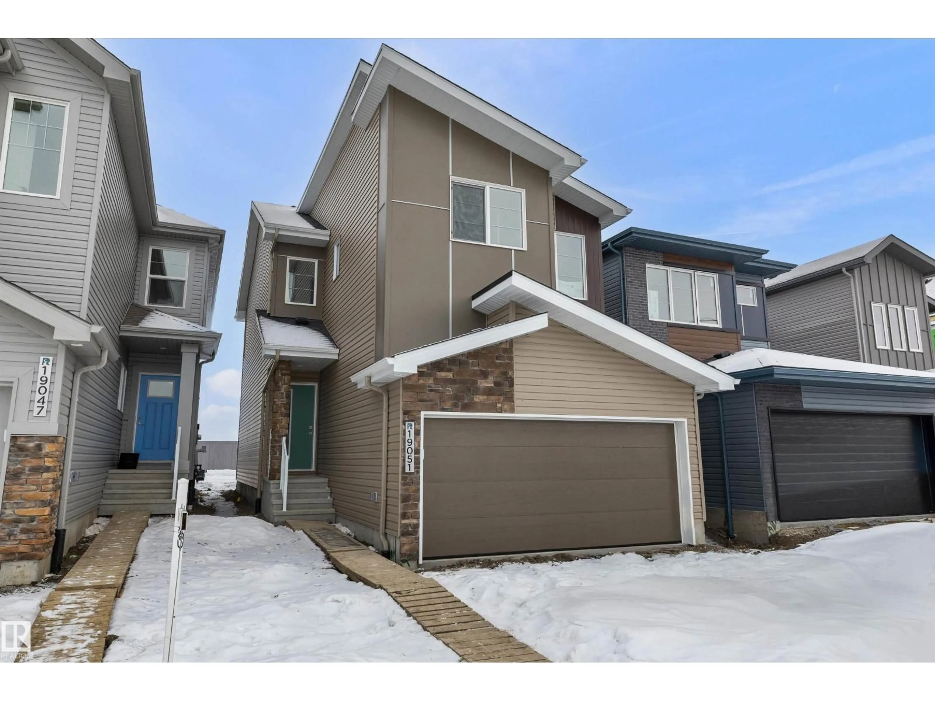 A pic from outside/outdoor area/front of a property/back of a property/a pic from drone, street for 19051 20 AV, Edmonton Alberta T6M3E8
