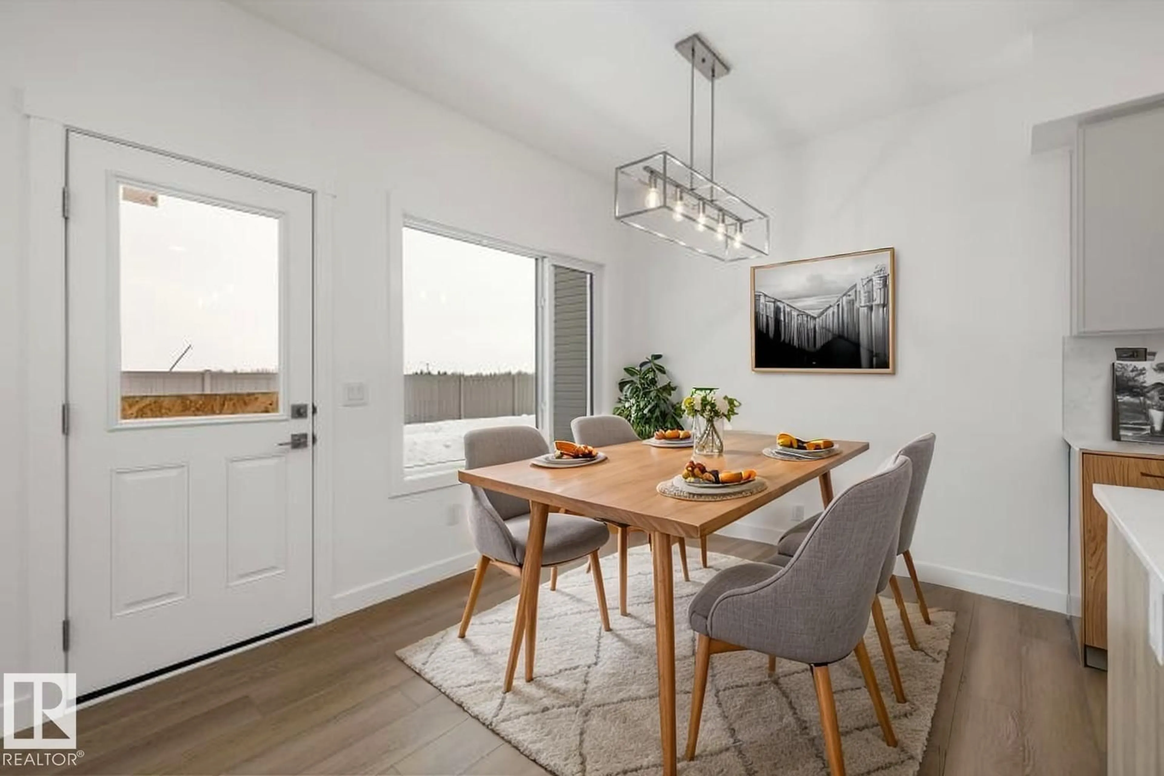 Dining room, wood/laminate floor for 19051 20 AV, Edmonton Alberta T6M3E8