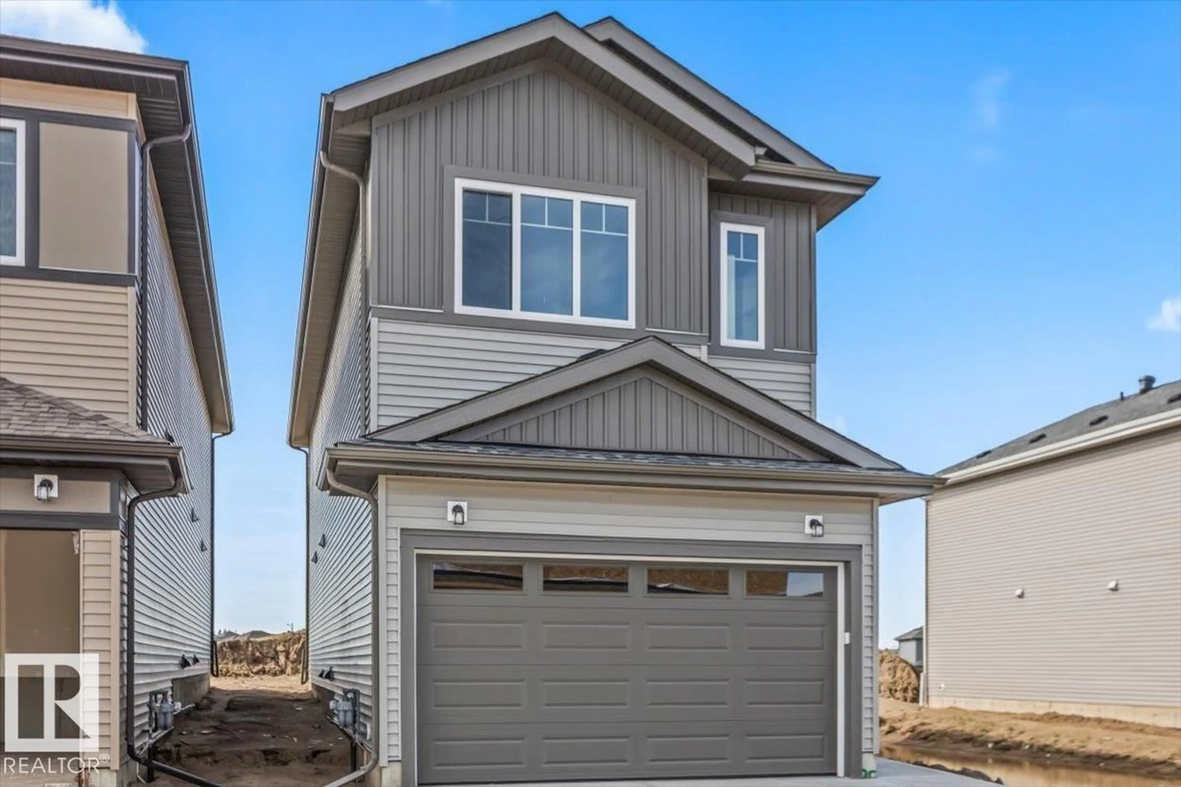 Home with vinyl exterior material, street for 25 FOXTAIL RD, Fort Saskatchewan Alberta T8L0Z5