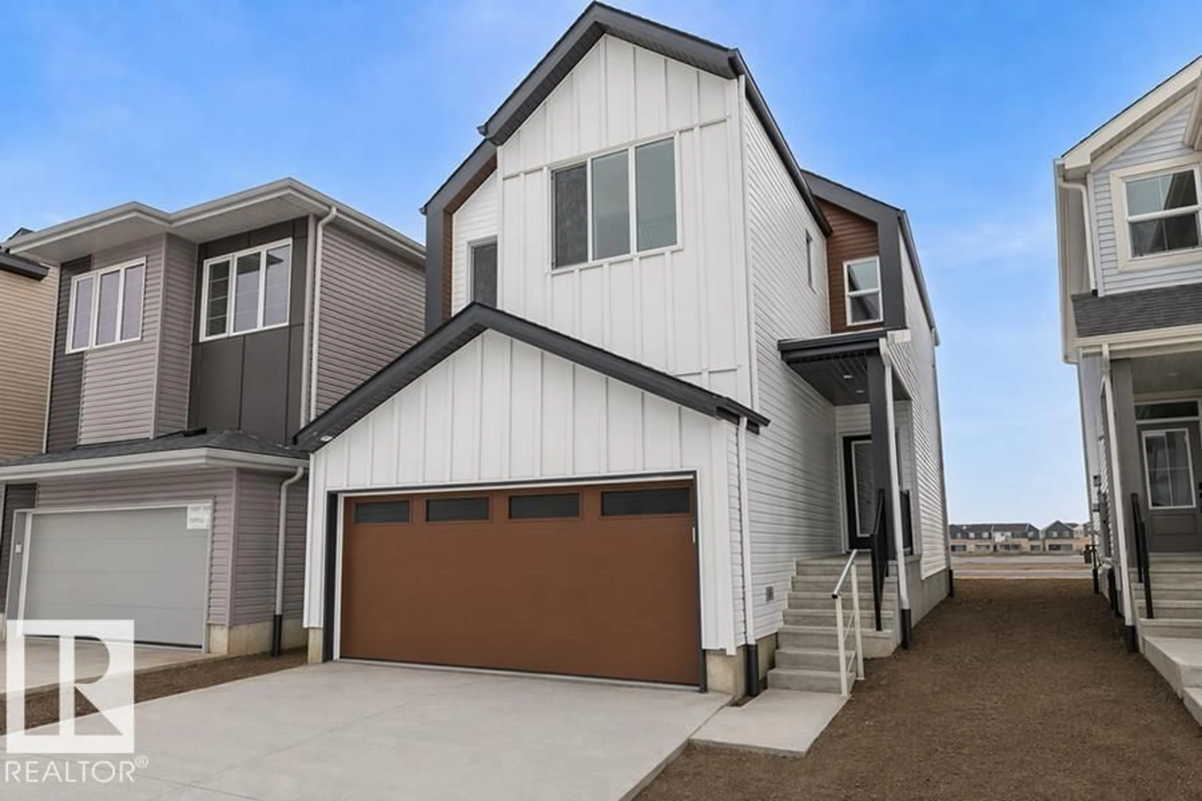 Home with vinyl exterior material, street for 18931 28 AV NW, Edmonton Alberta T6M3H9