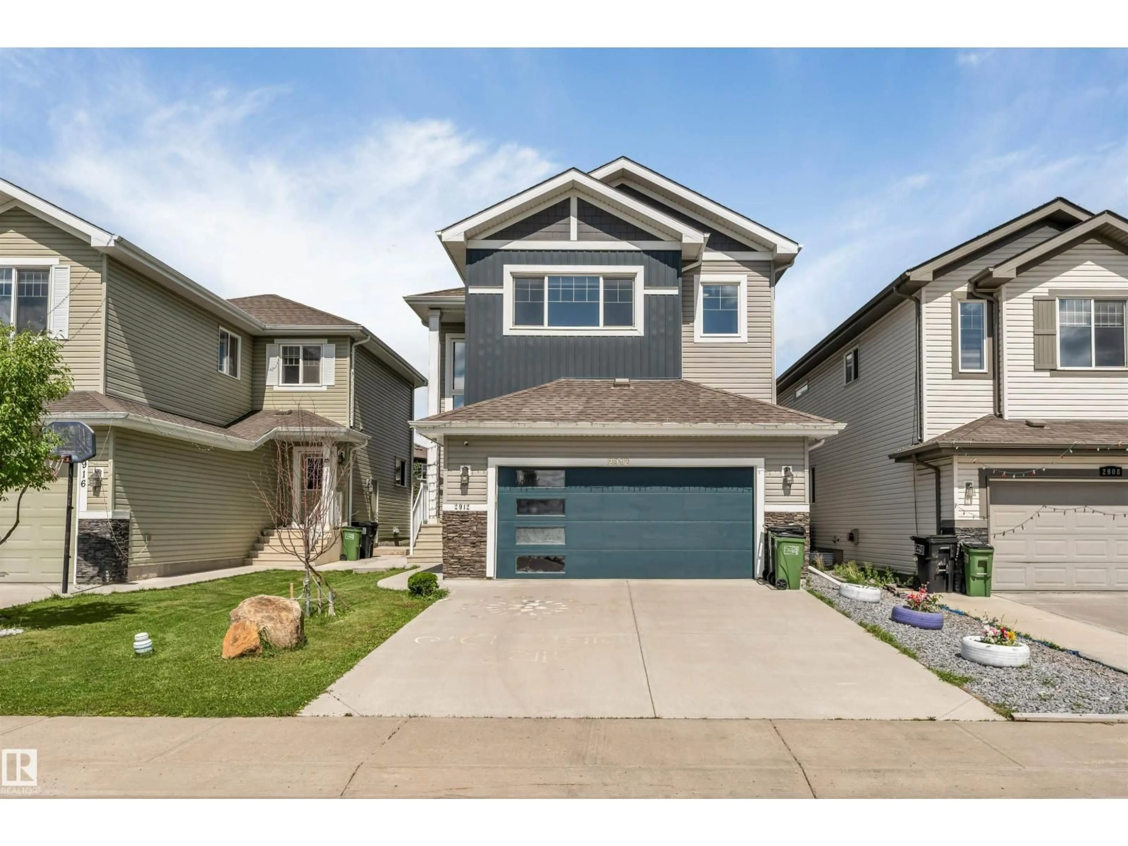 Home with vinyl exterior material, street for 2912 12 AV, Edmonton Alberta T6T1A9