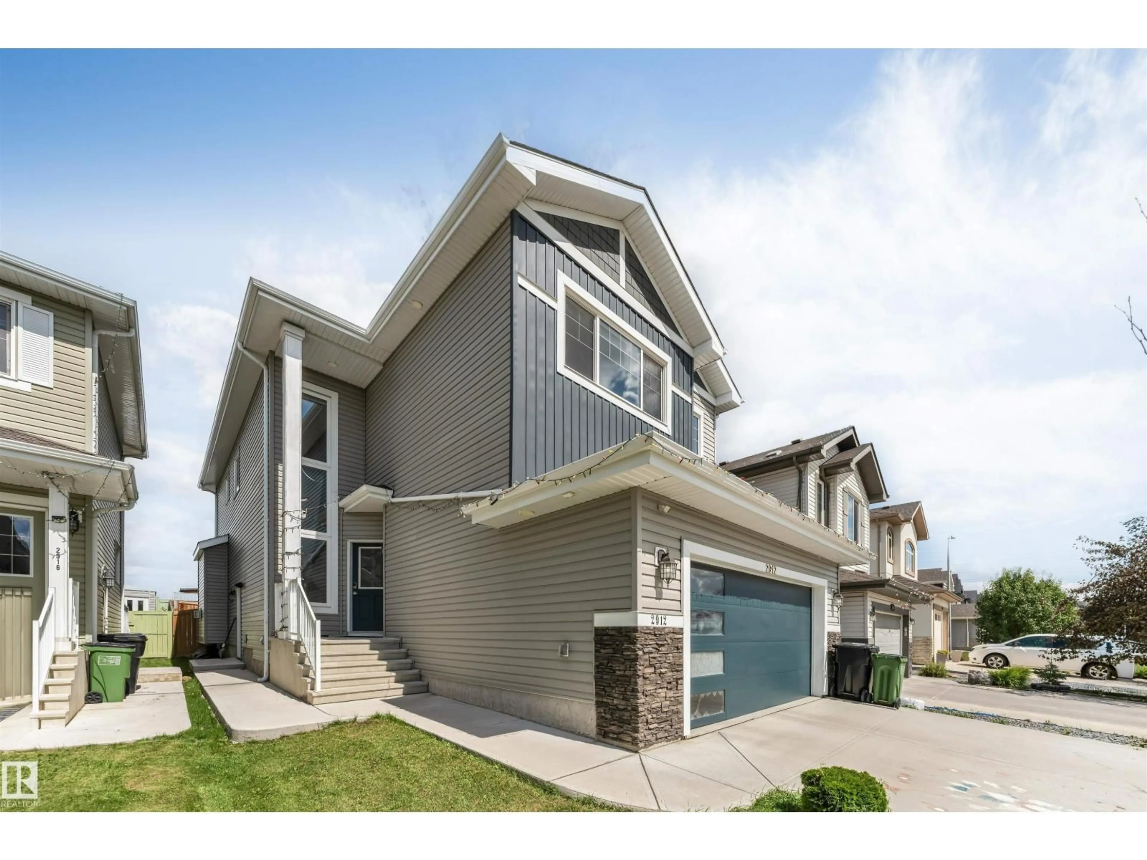Home with vinyl exterior material, street for 2912 12 AV, Edmonton Alberta T6T1A9