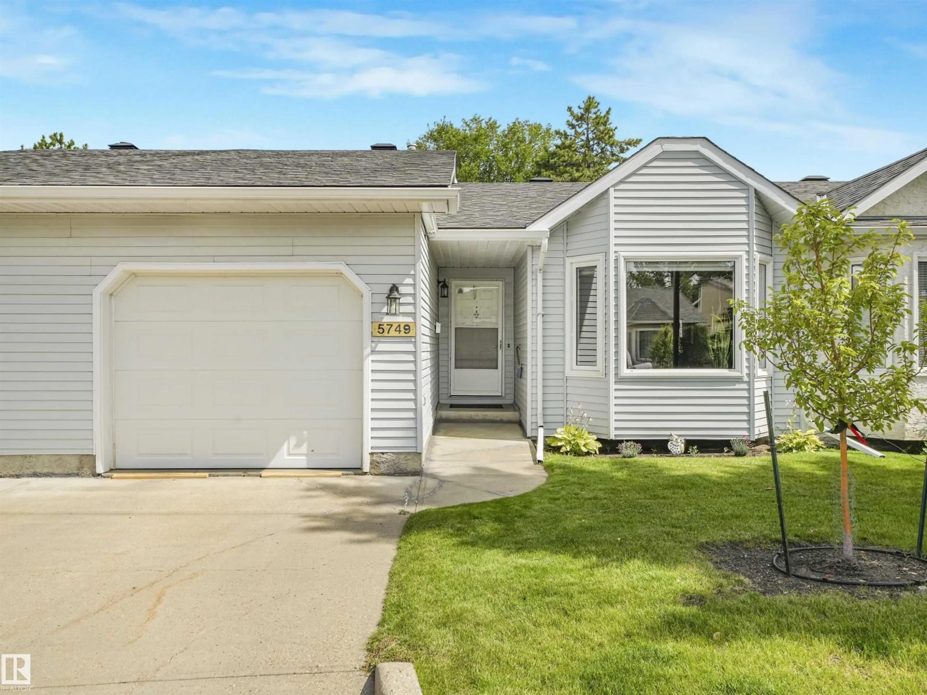 Home with vinyl exterior material, street for 5749 189 ST, Edmonton Alberta T6M2G8