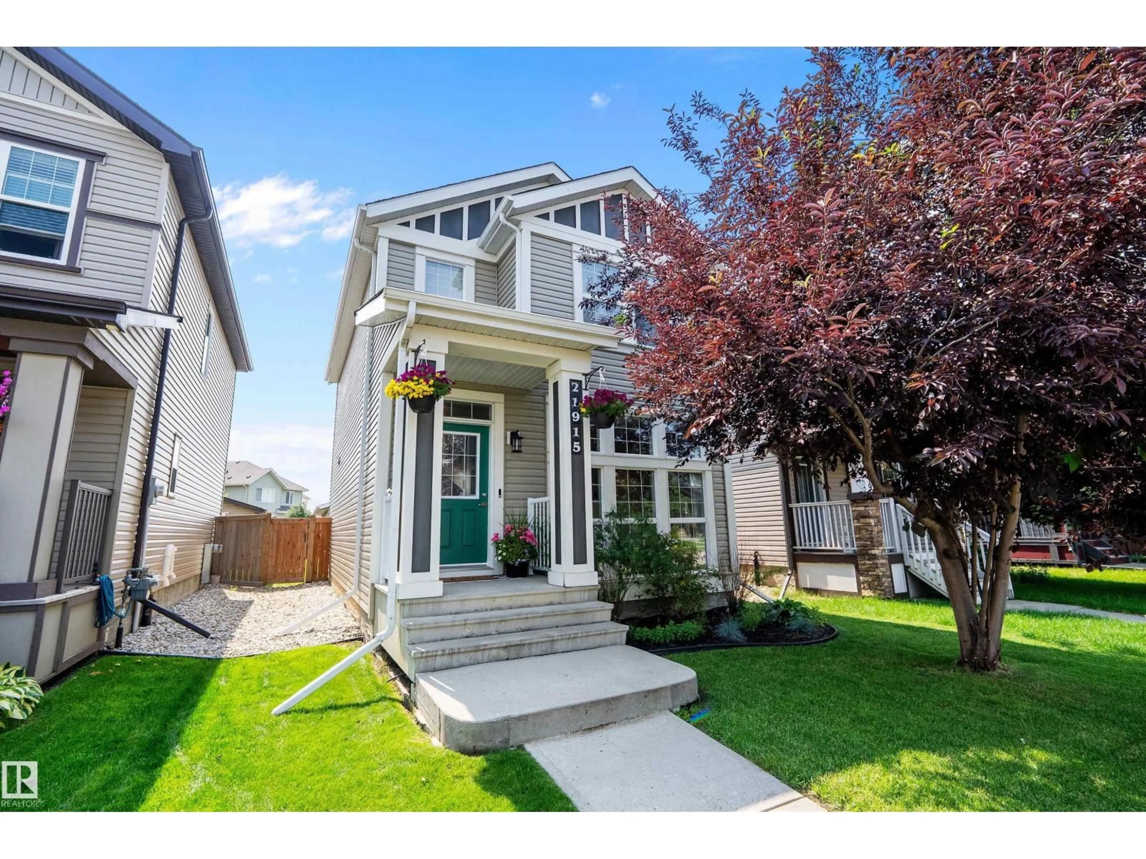 Home with vinyl exterior material, street for 21915 99 AV, Edmonton Alberta T5T4M5