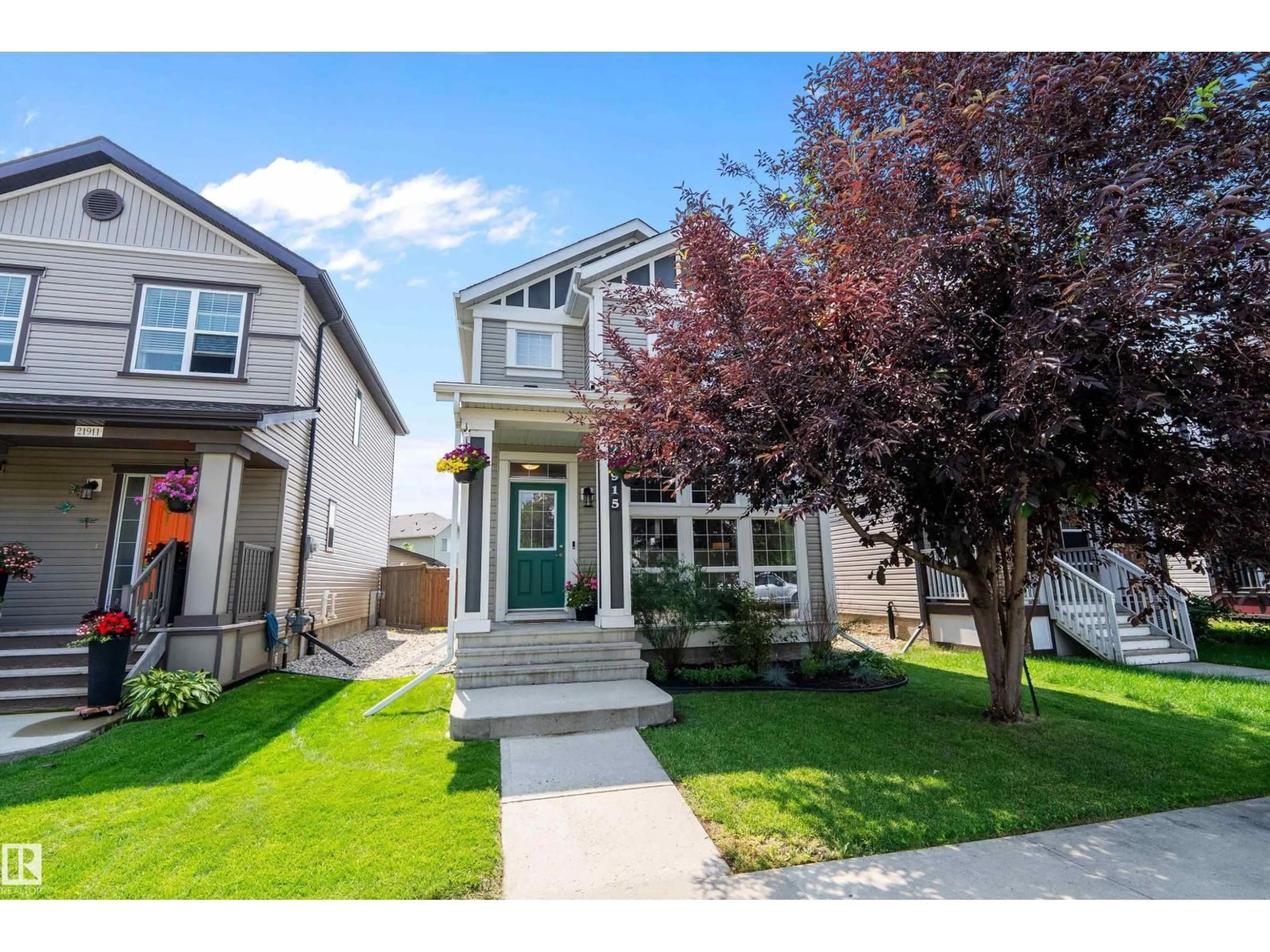 Home with vinyl exterior material, street for 21915 99 AV, Edmonton Alberta T5T4M5