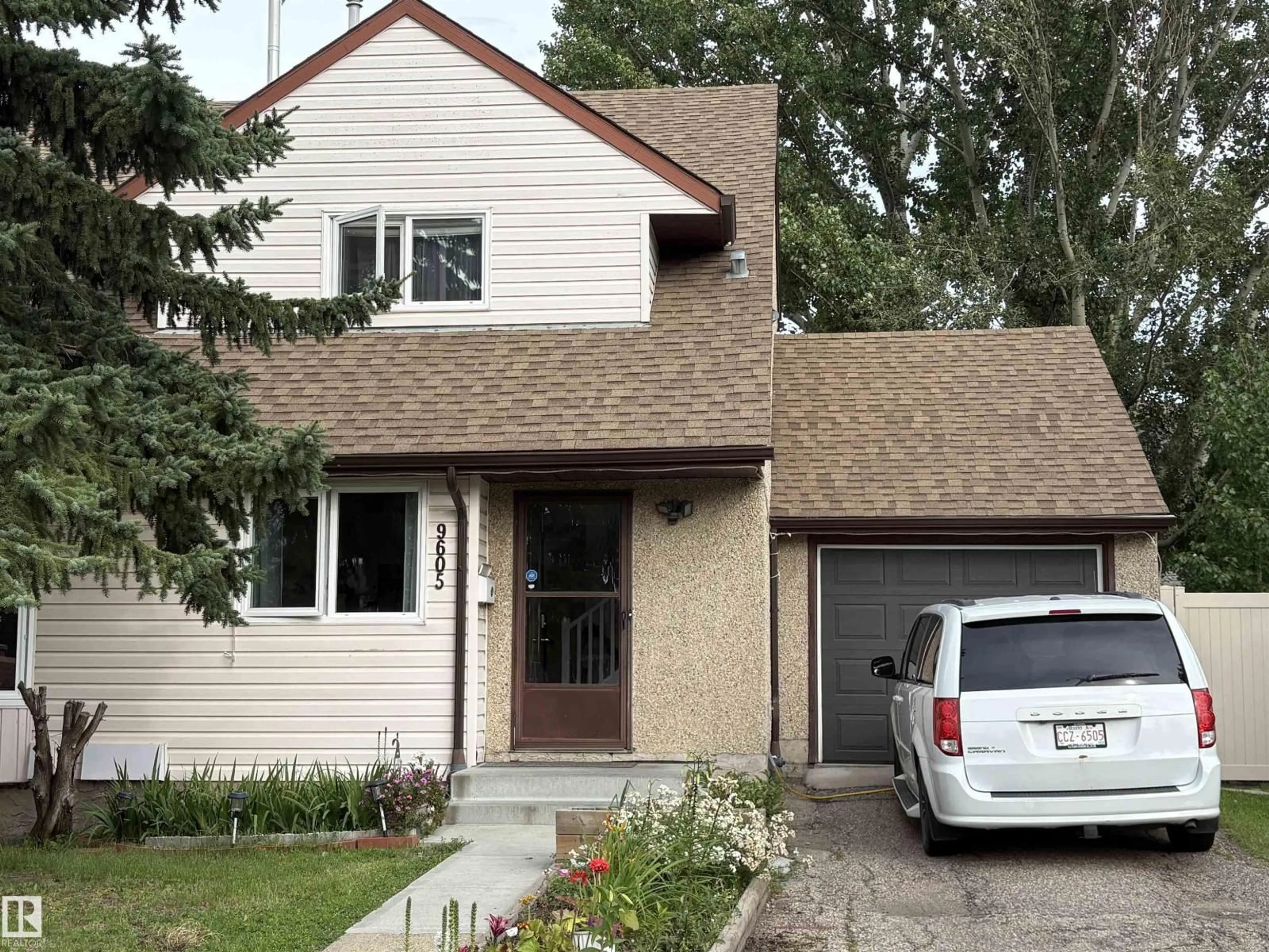 Home with vinyl exterior material, street for 9605 180 ST, Edmonton Alberta T5T2Z9