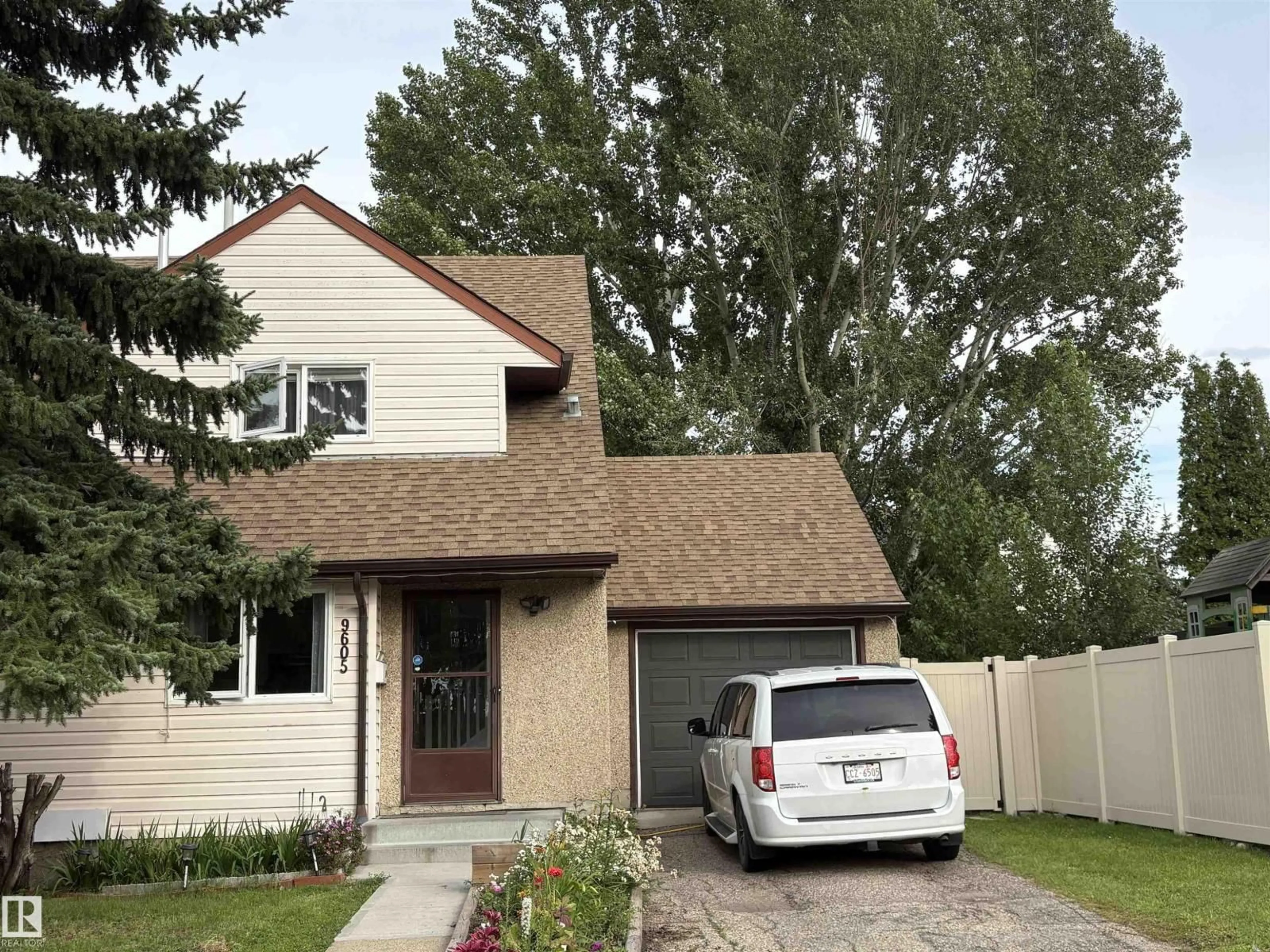 Home with vinyl exterior material, street for 9605 180 ST, Edmonton Alberta T5T2Z9