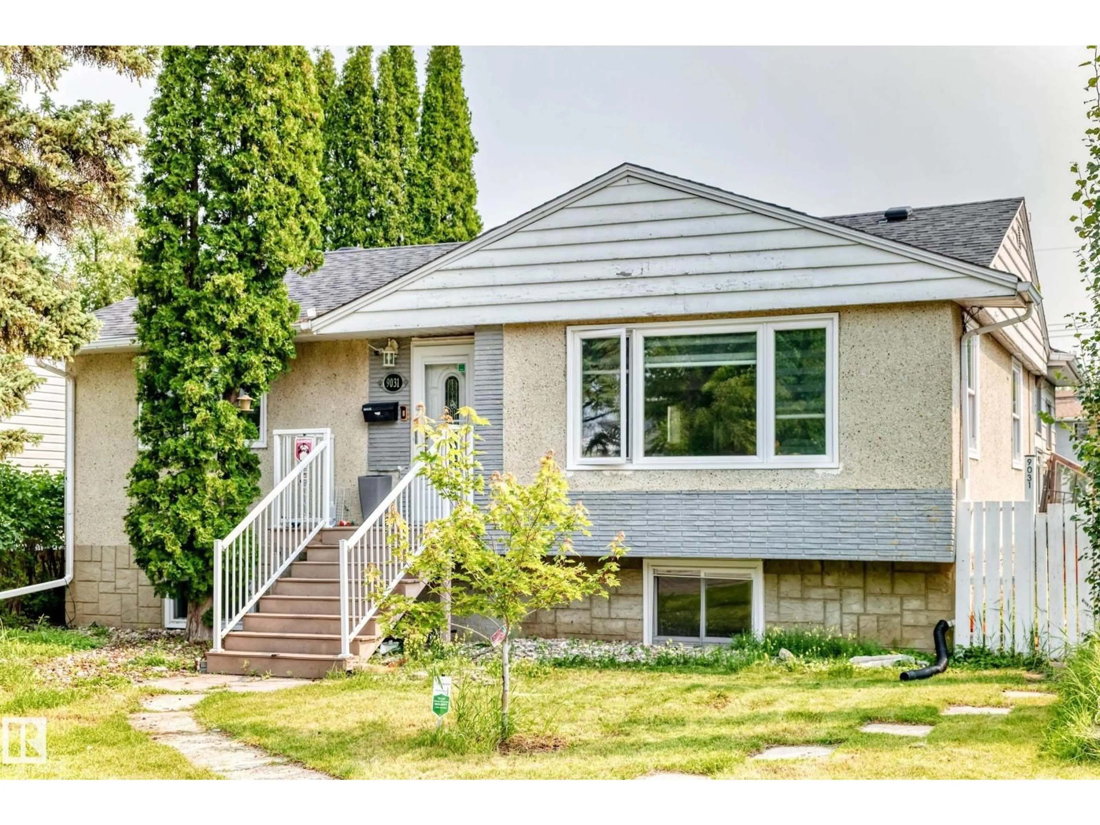 Home with vinyl exterior material, street for 9031 150 ST, Edmonton Alberta T5R1E8