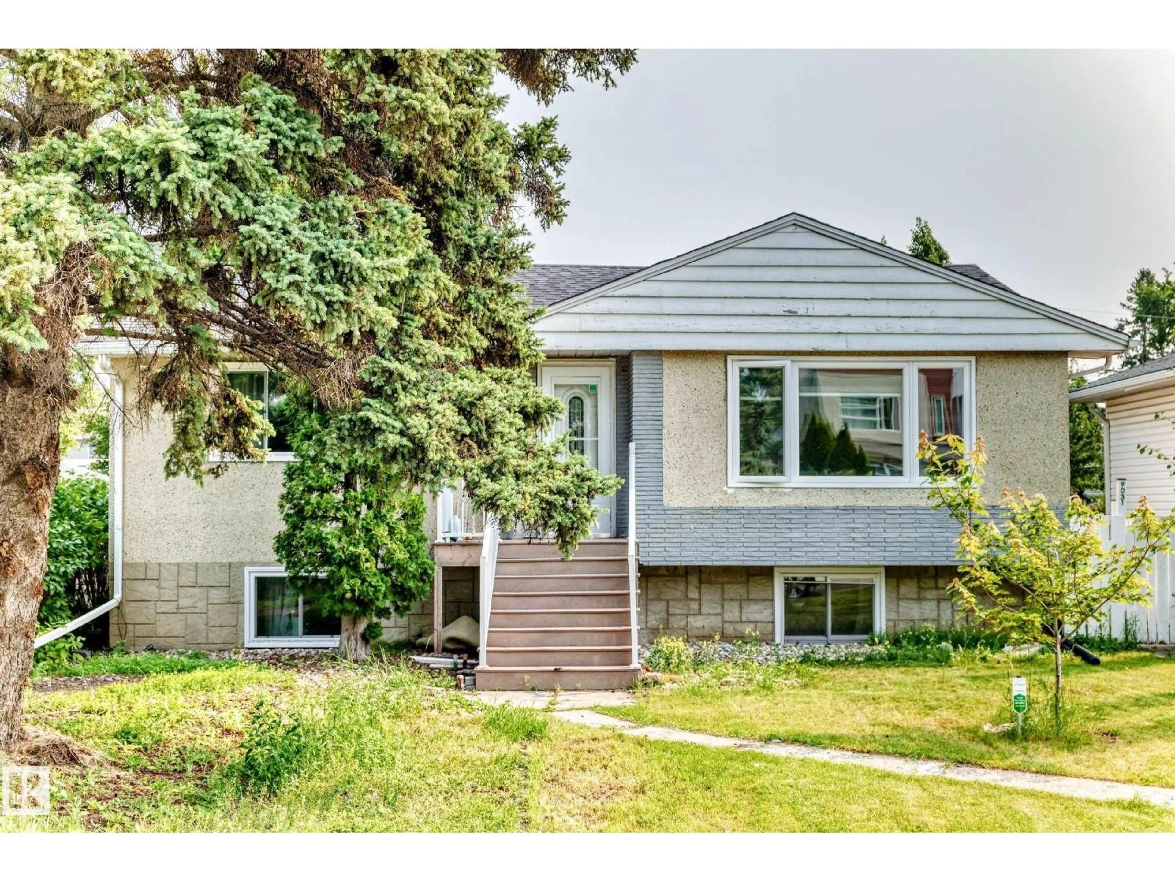 Home with vinyl exterior material, street for 9031 150 ST, Edmonton Alberta T5R1E8