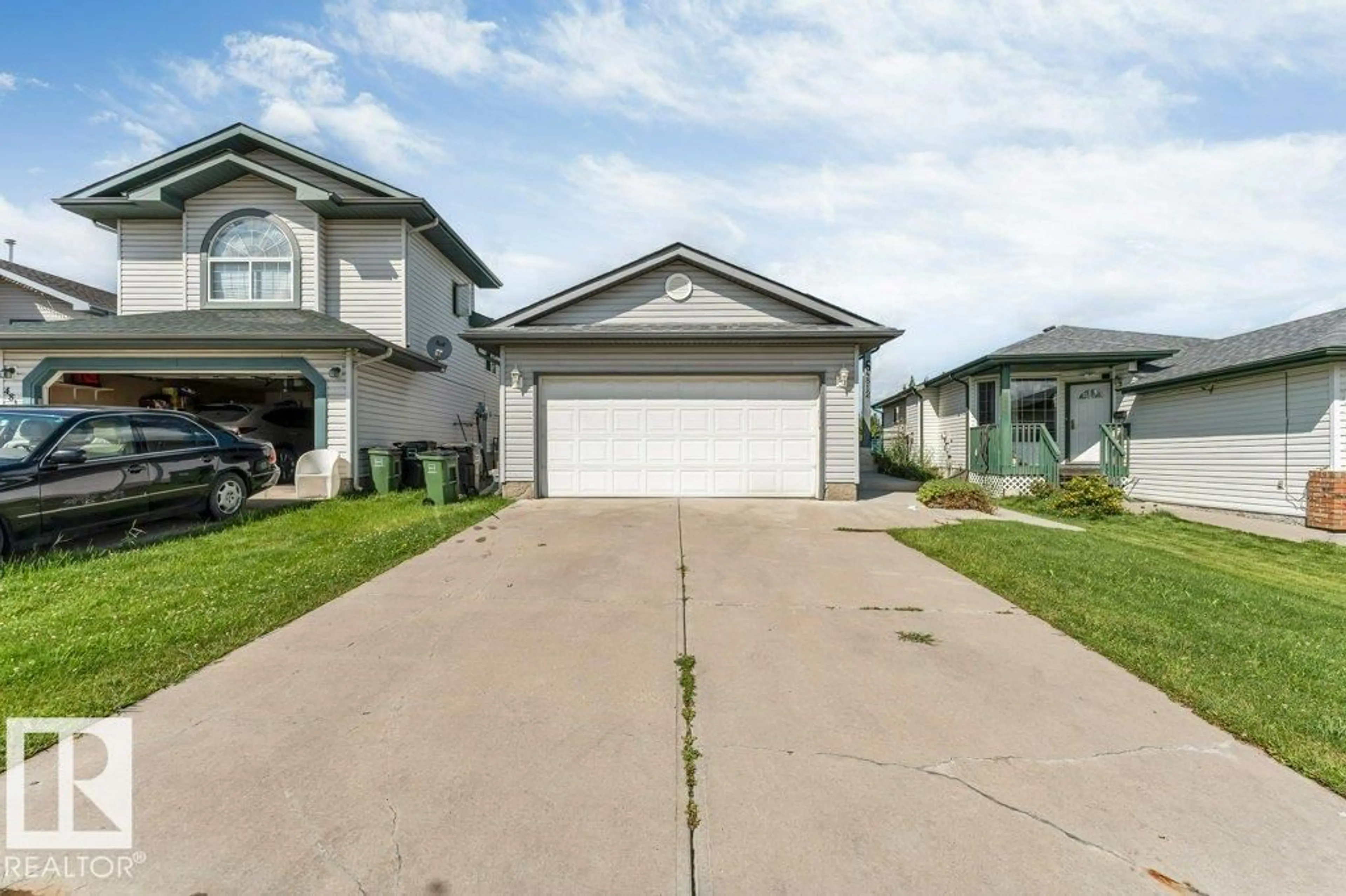Home with vinyl exterior material, street for 4812 148 AV, Edmonton Alberta T5T2X1