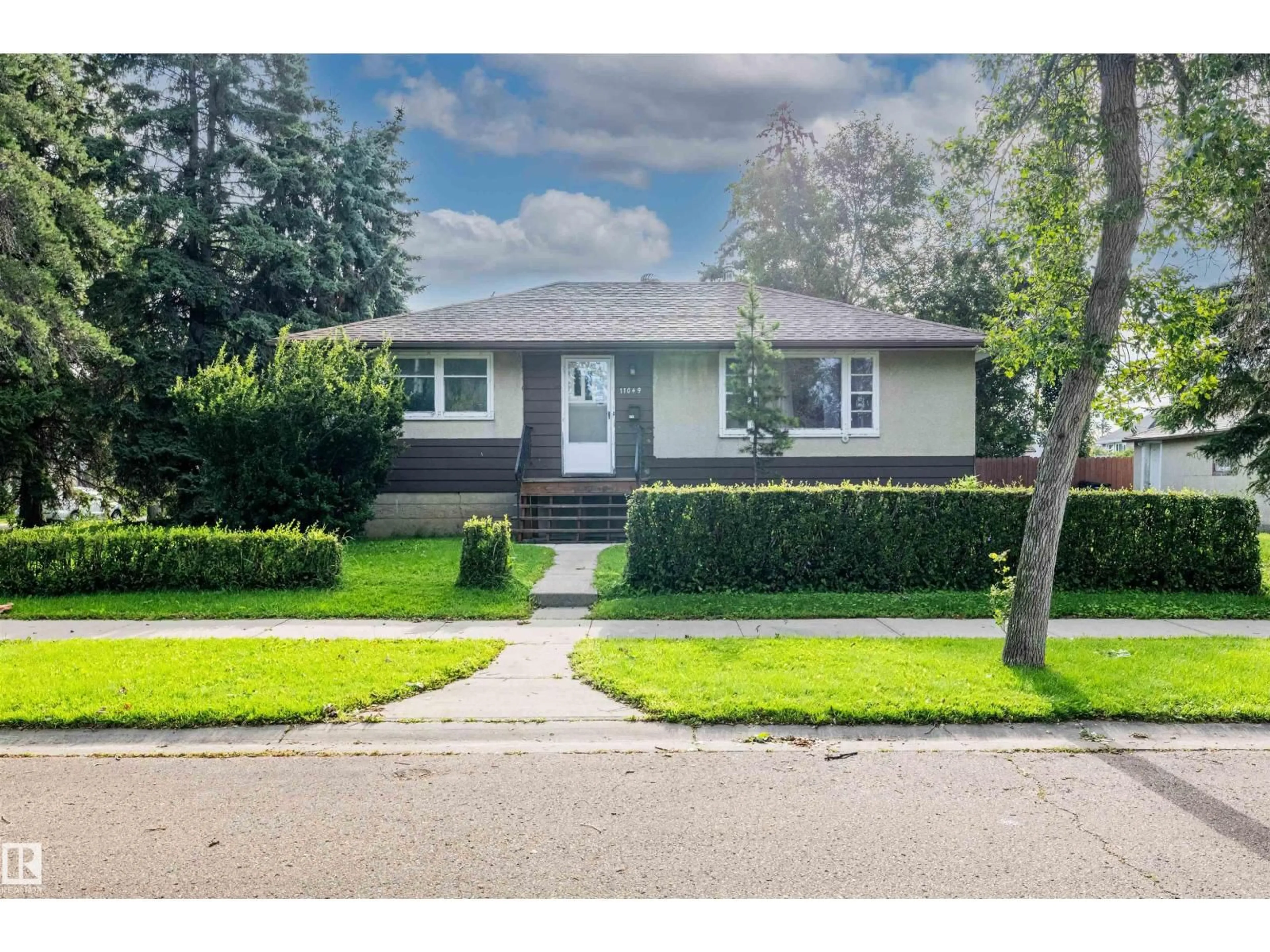 Home with vinyl exterior material, street for 11049 145 ST, Edmonton Alberta T5N2Y7