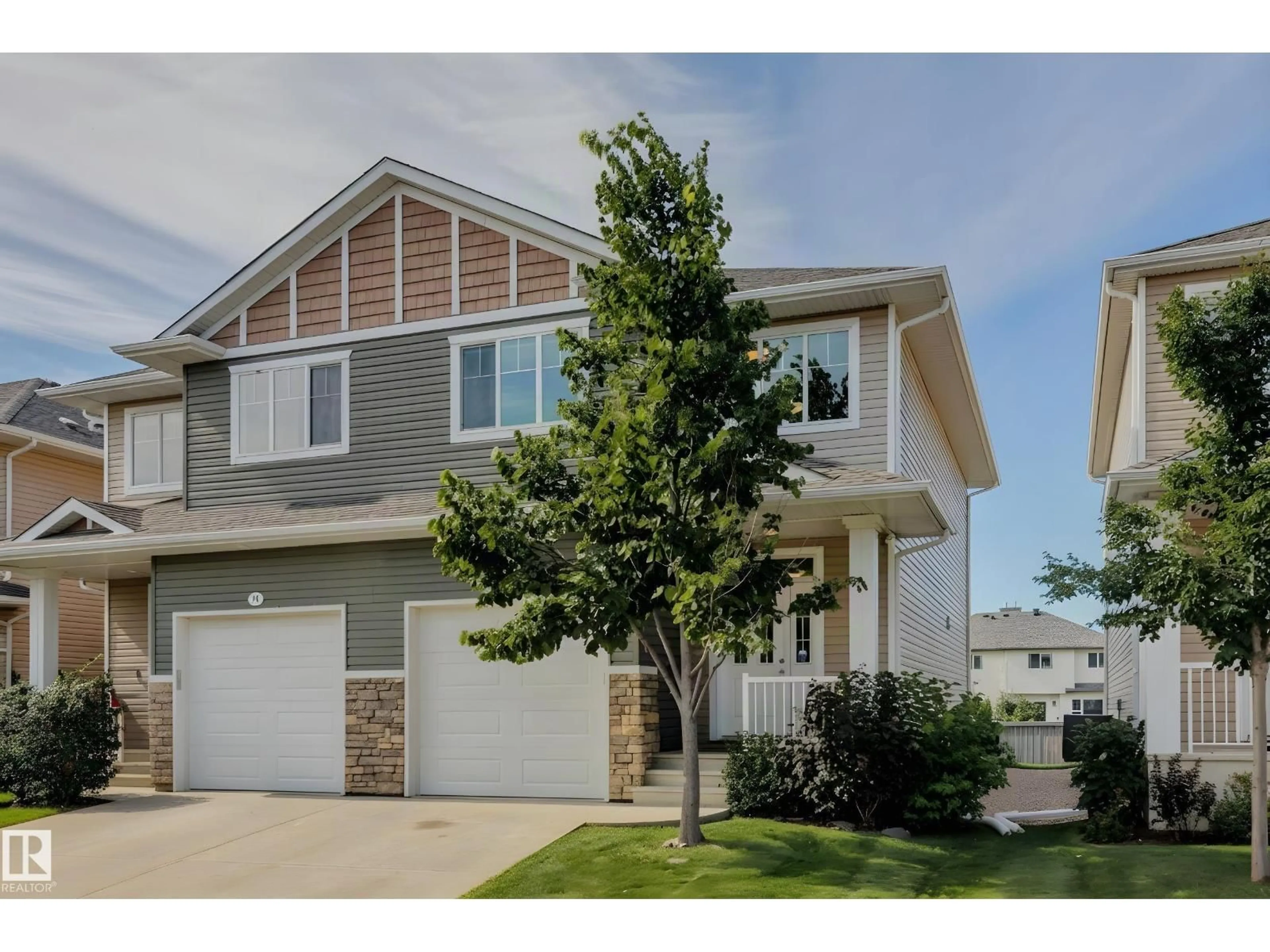 Home with vinyl exterior material, street for 12 18230 104A ST, Edmonton Alberta T5X0G9