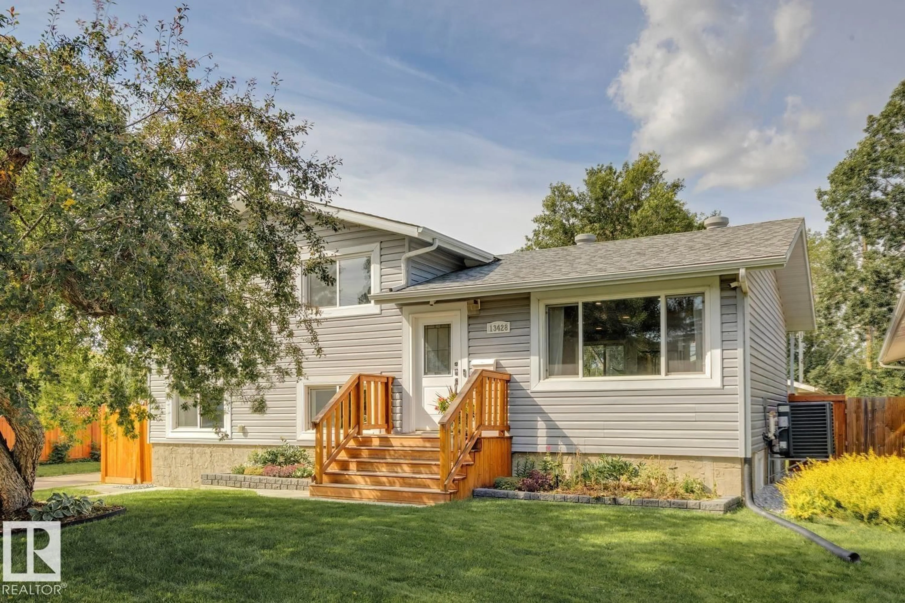 Home with vinyl exterior material, street for 13428 117A AV, Edmonton Alberta T5M3J7
