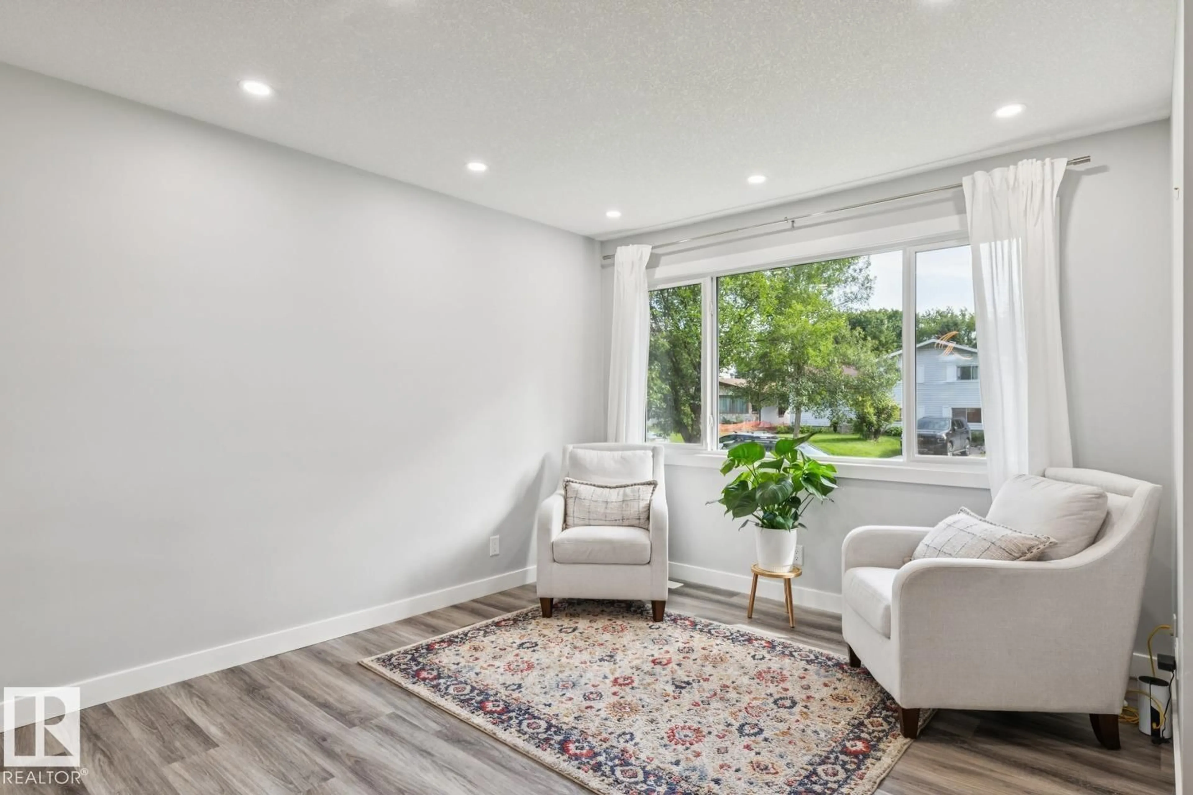 Living room with furniture, unknown for 13428 117A AV, Edmonton Alberta T5M3J7
