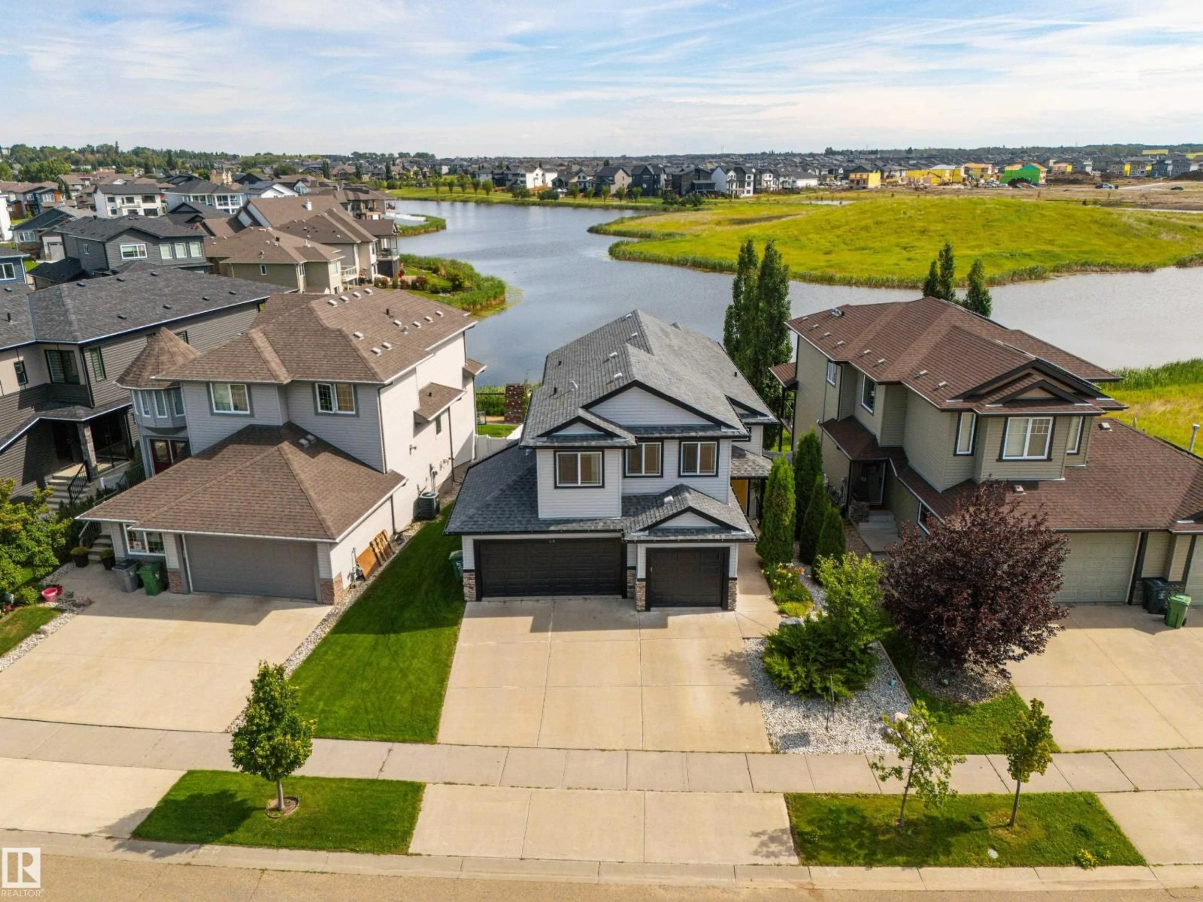 A pic from outside/outdoor area/front of a property/back of a property/a pic from drone, water/lake/river/ocean view for 65 LAKEWOOD BV, Beaumont Alberta T4X0B5