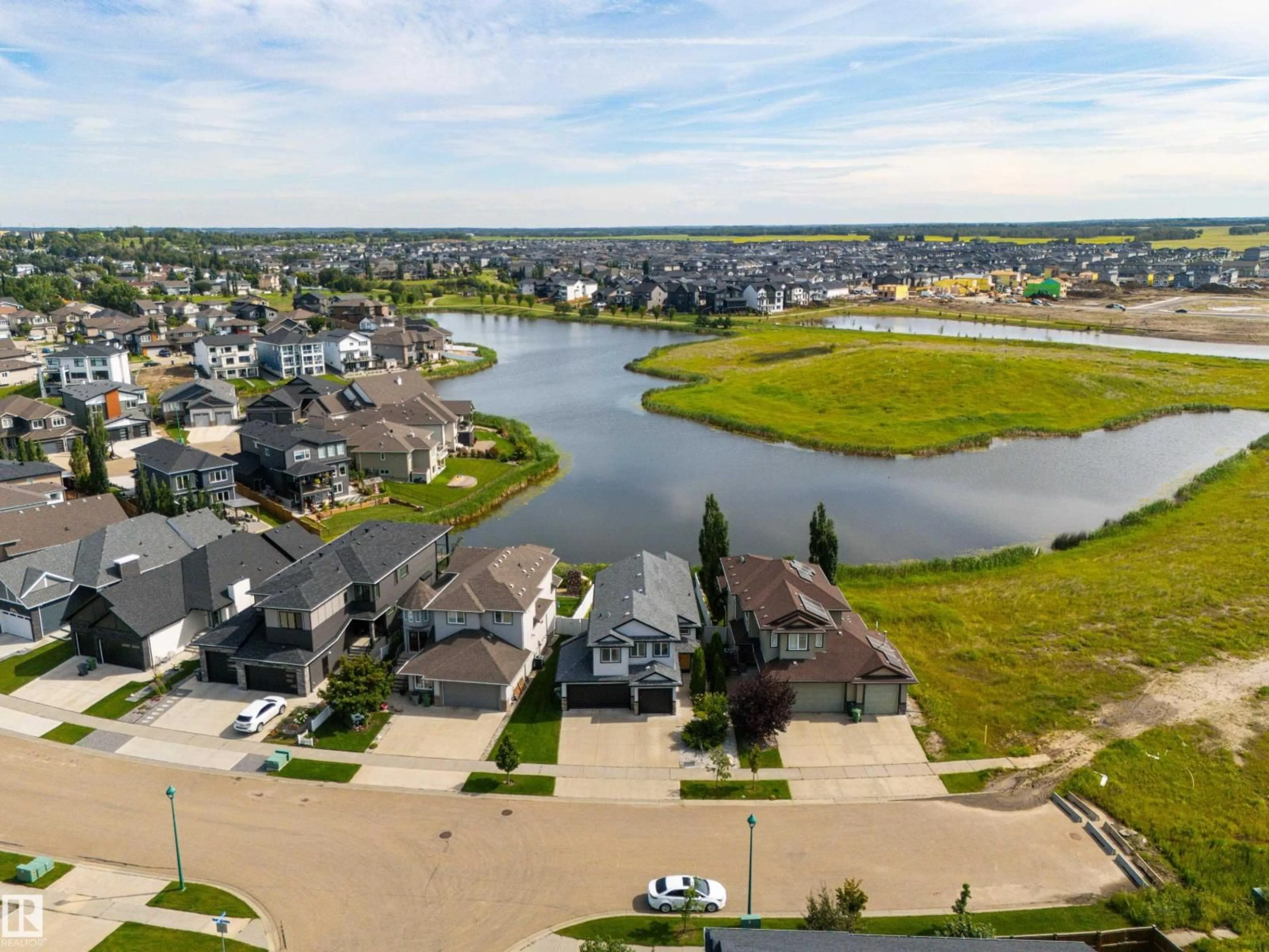 A pic from outside/outdoor area/front of a property/back of a property/a pic from drone, water/lake/river/ocean view for 65 LAKEWOOD BV, Beaumont Alberta T4X0B5