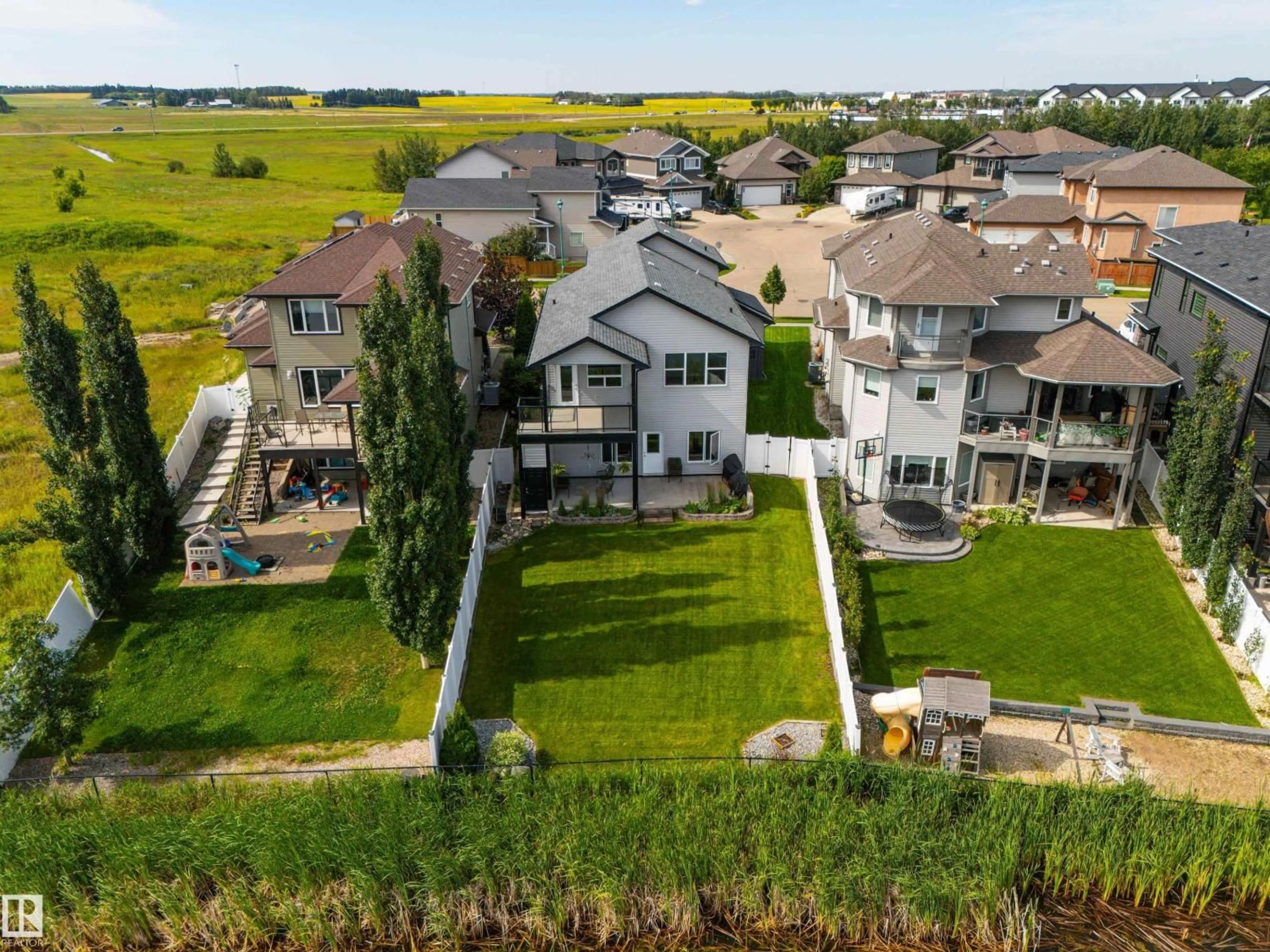 A pic from outside/outdoor area/front of a property/back of a property/a pic from drone, water/lake/river/ocean view for 65 LAKEWOOD BV, Beaumont Alberta T4X0B5