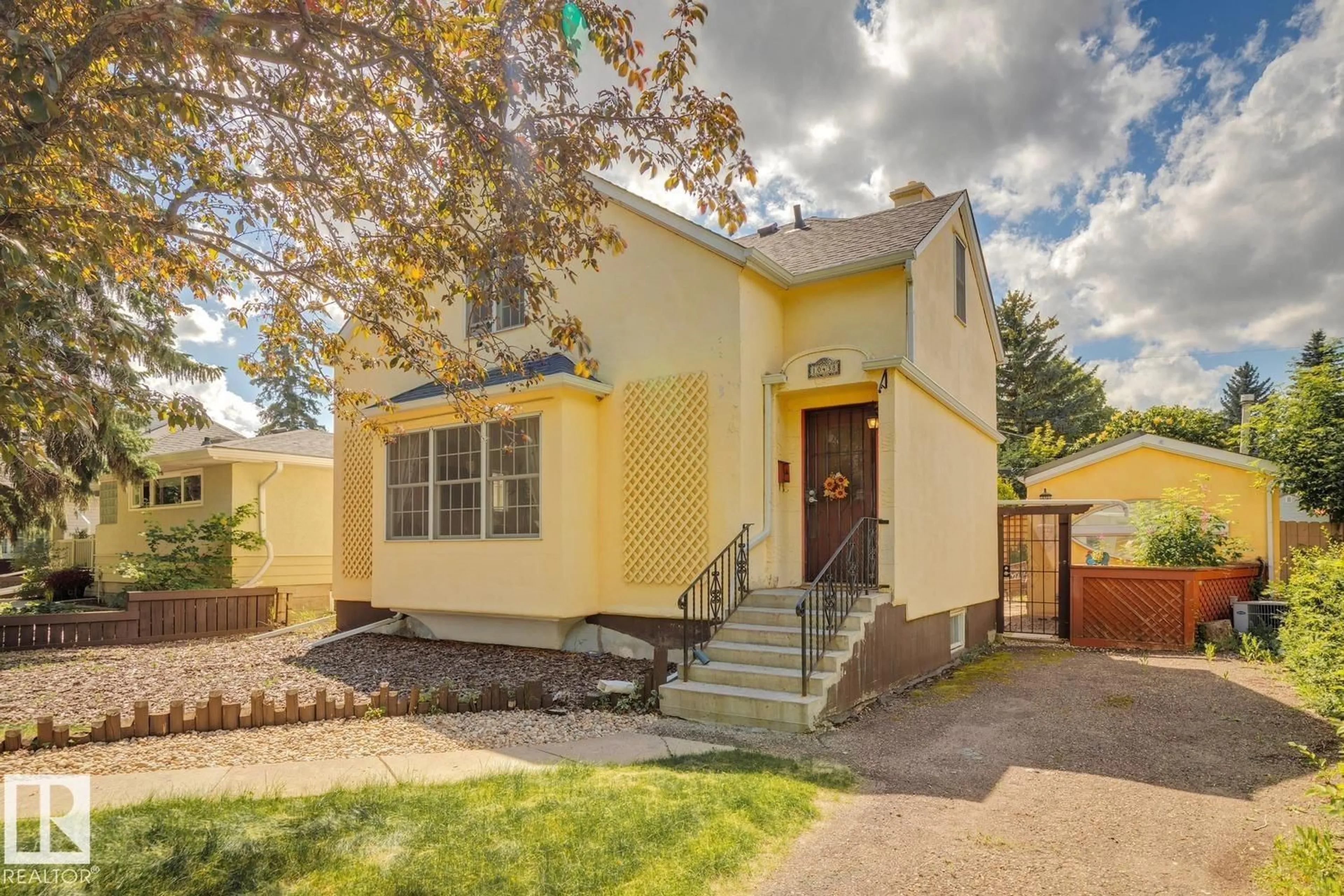 Home with vinyl exterior material, street for 10438 133 STREET, Edmonton Alberta T5N2A1